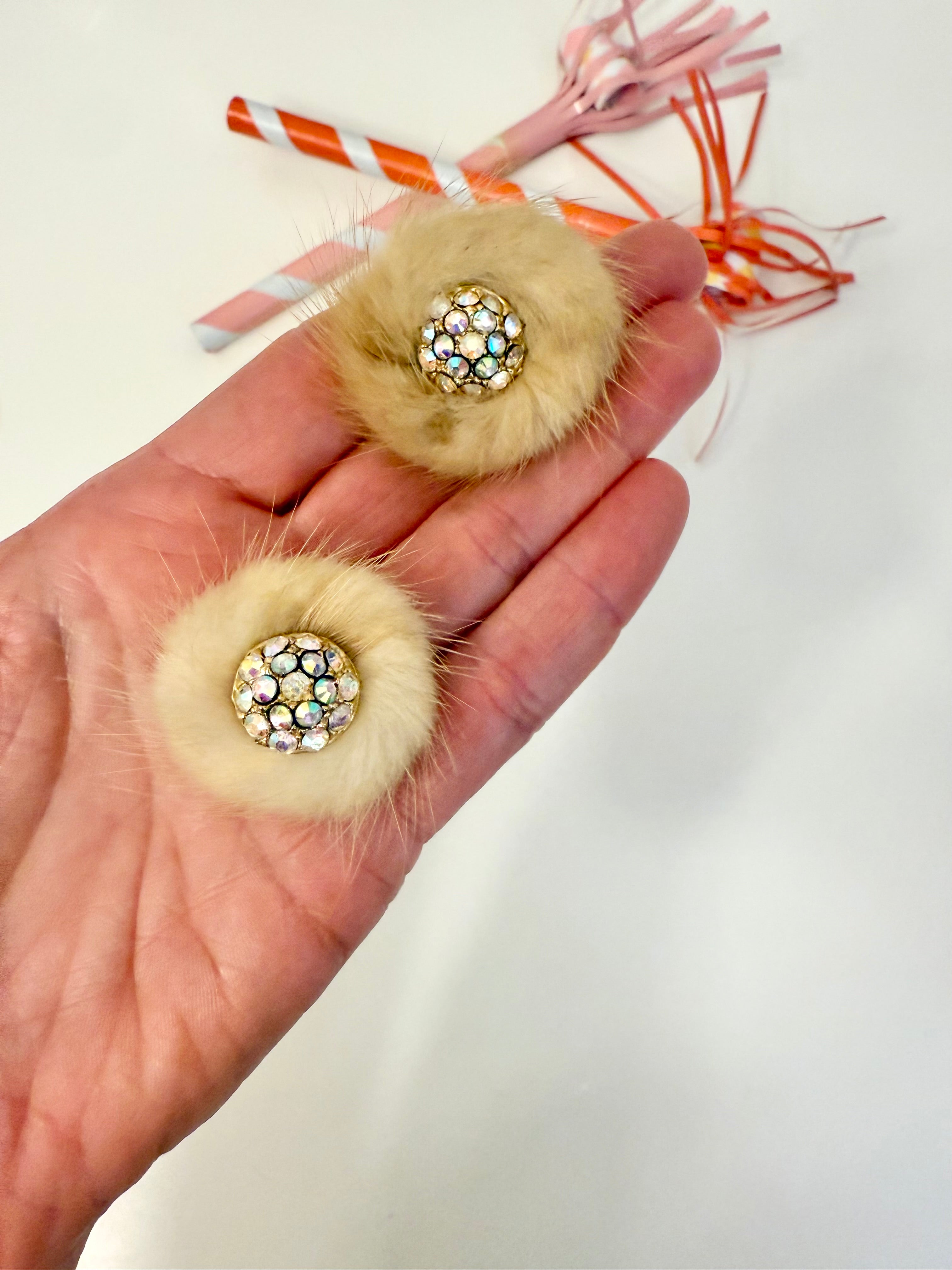 The mink button earring....