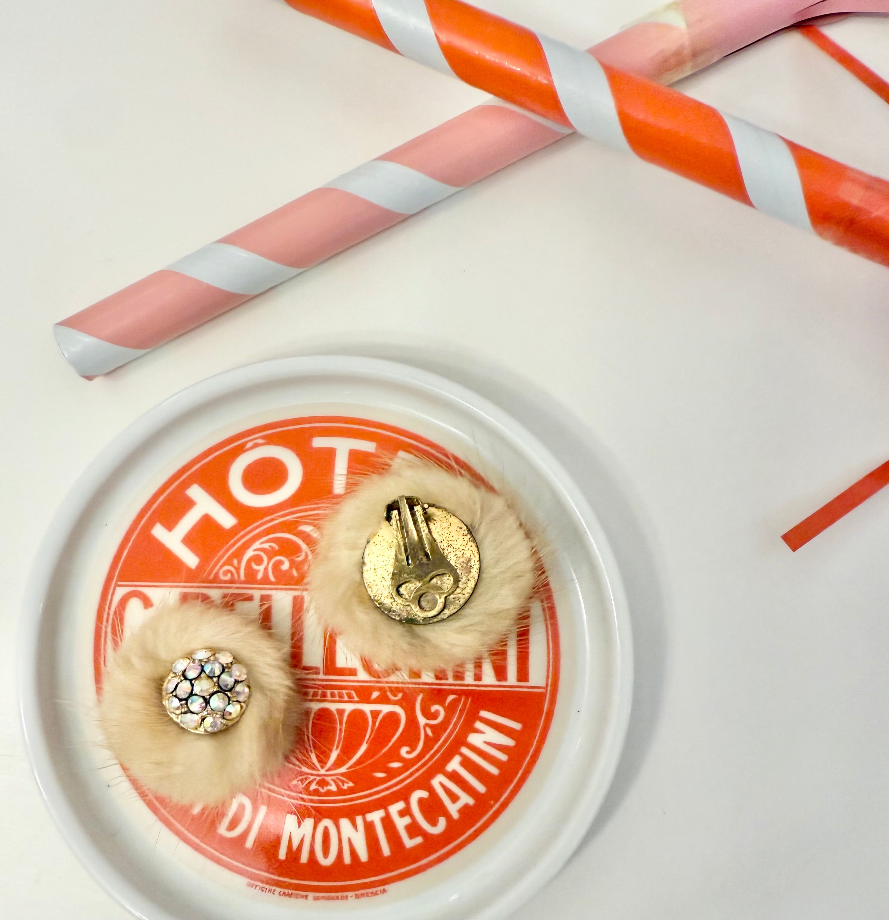 The mink button earring....