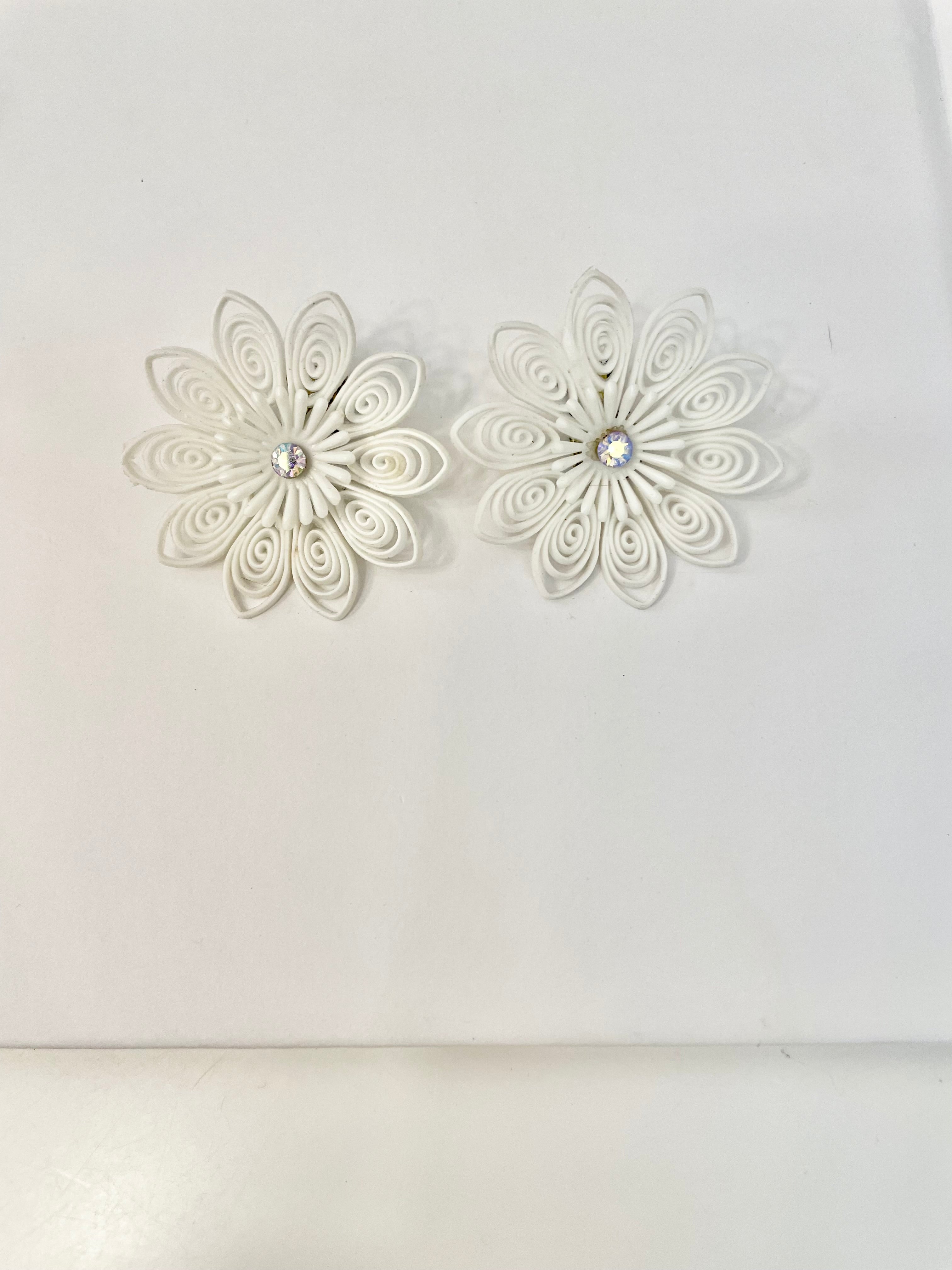 She just loves flowers... these blanc filigree resin flowers are truly divine!