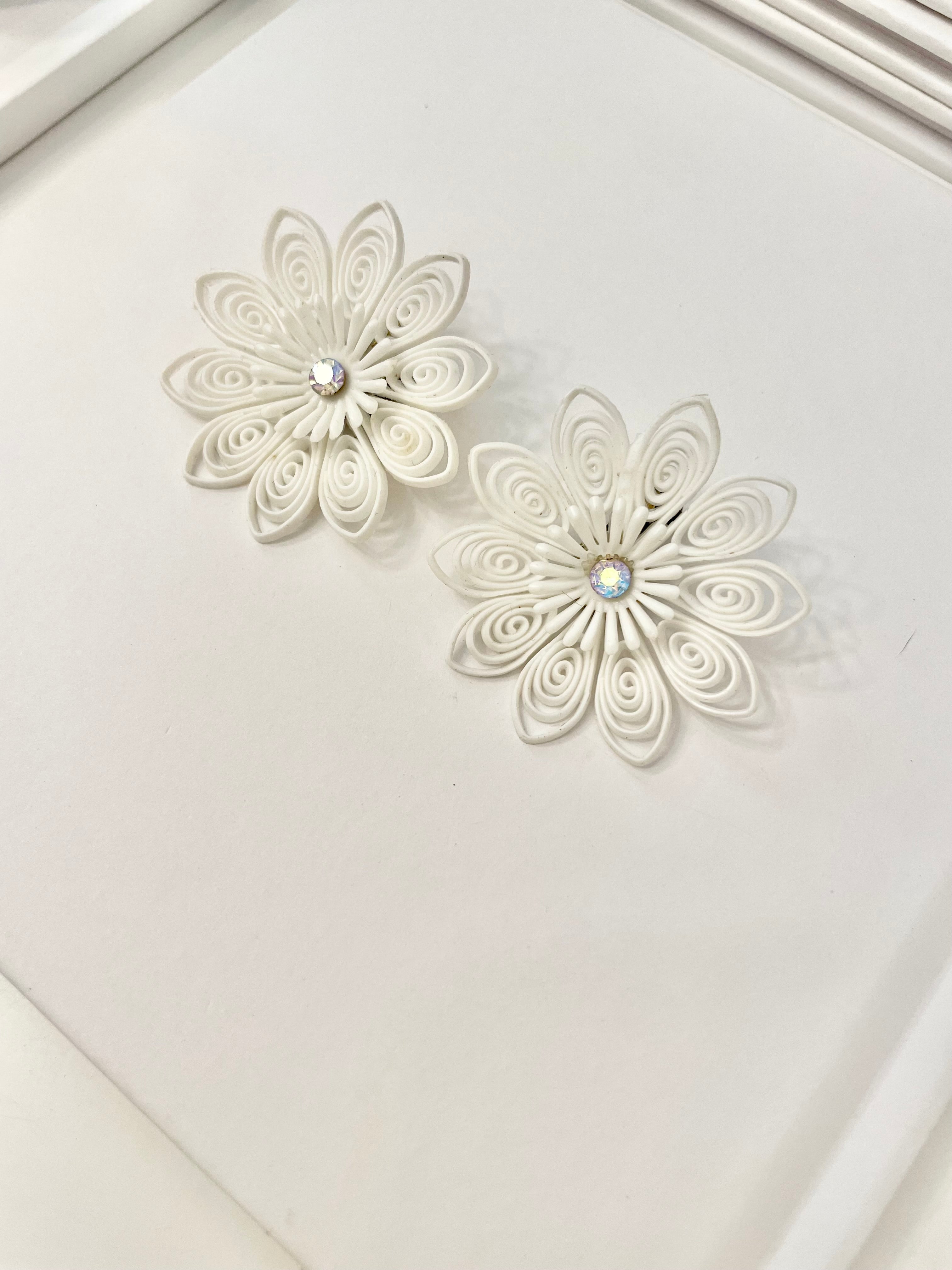 She just loves flowers... these blanc filigree resin flowers are truly divine!