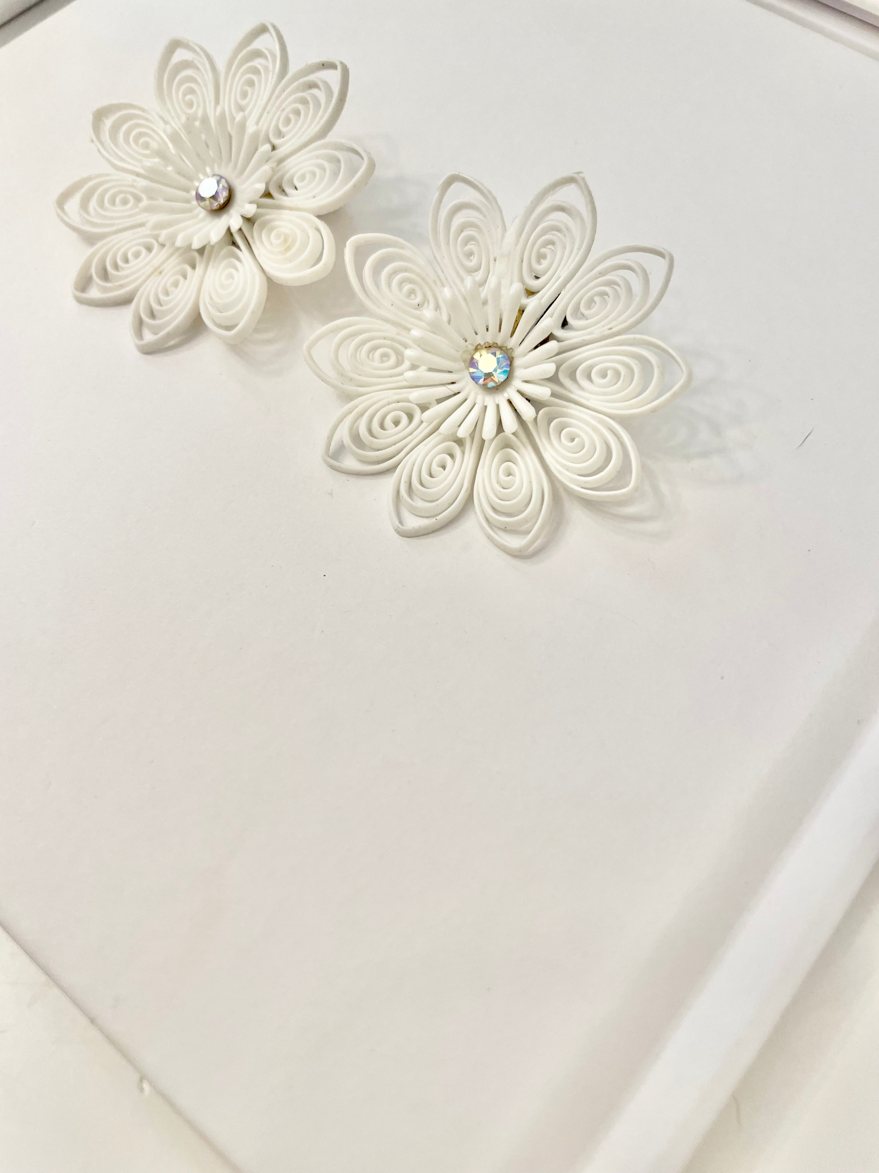 She just loves flowers... these blanc filigree resin flowers are truly divine!