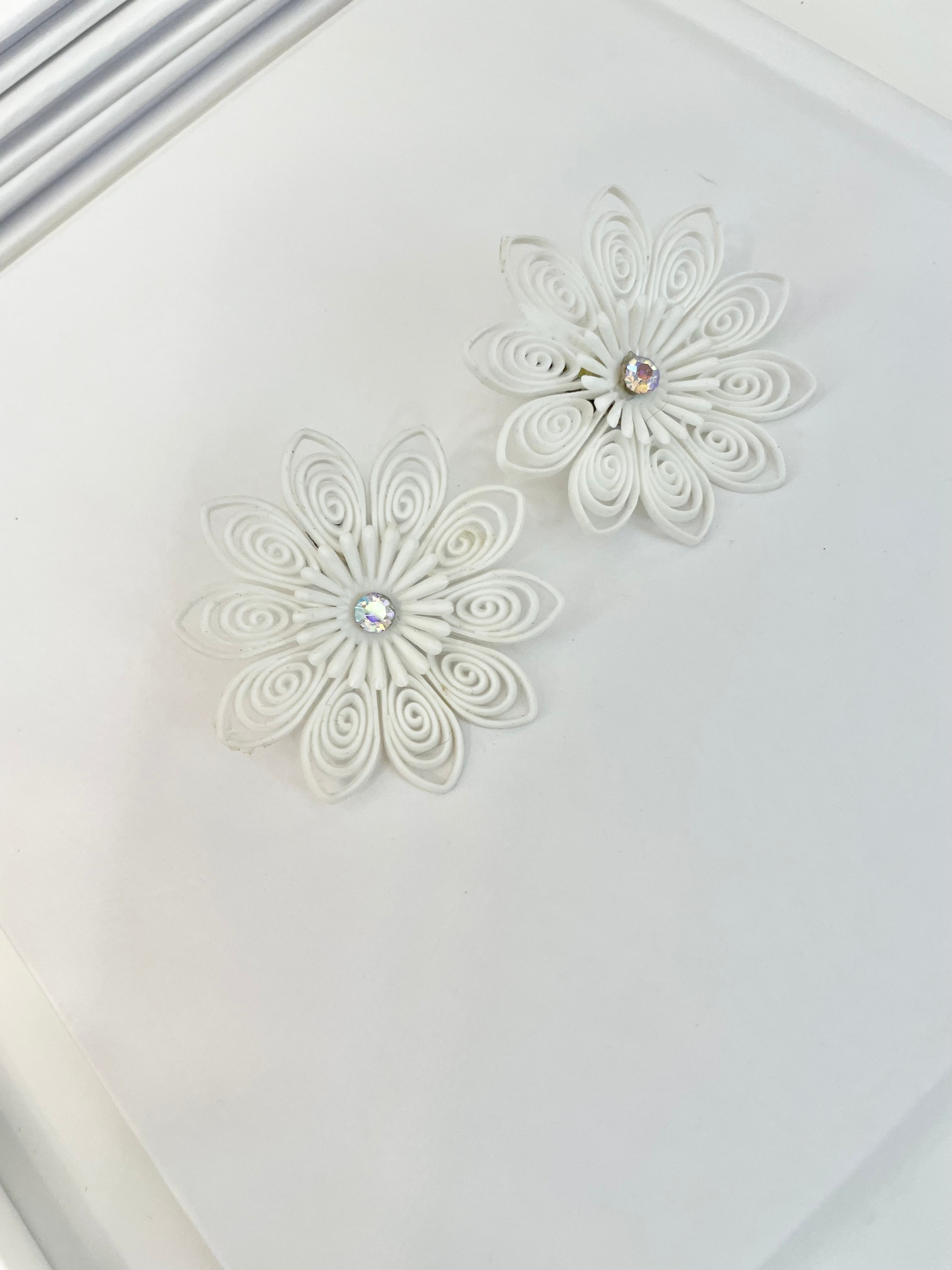 She just loves flowers... these blanc filigree resin flowers are truly divine!