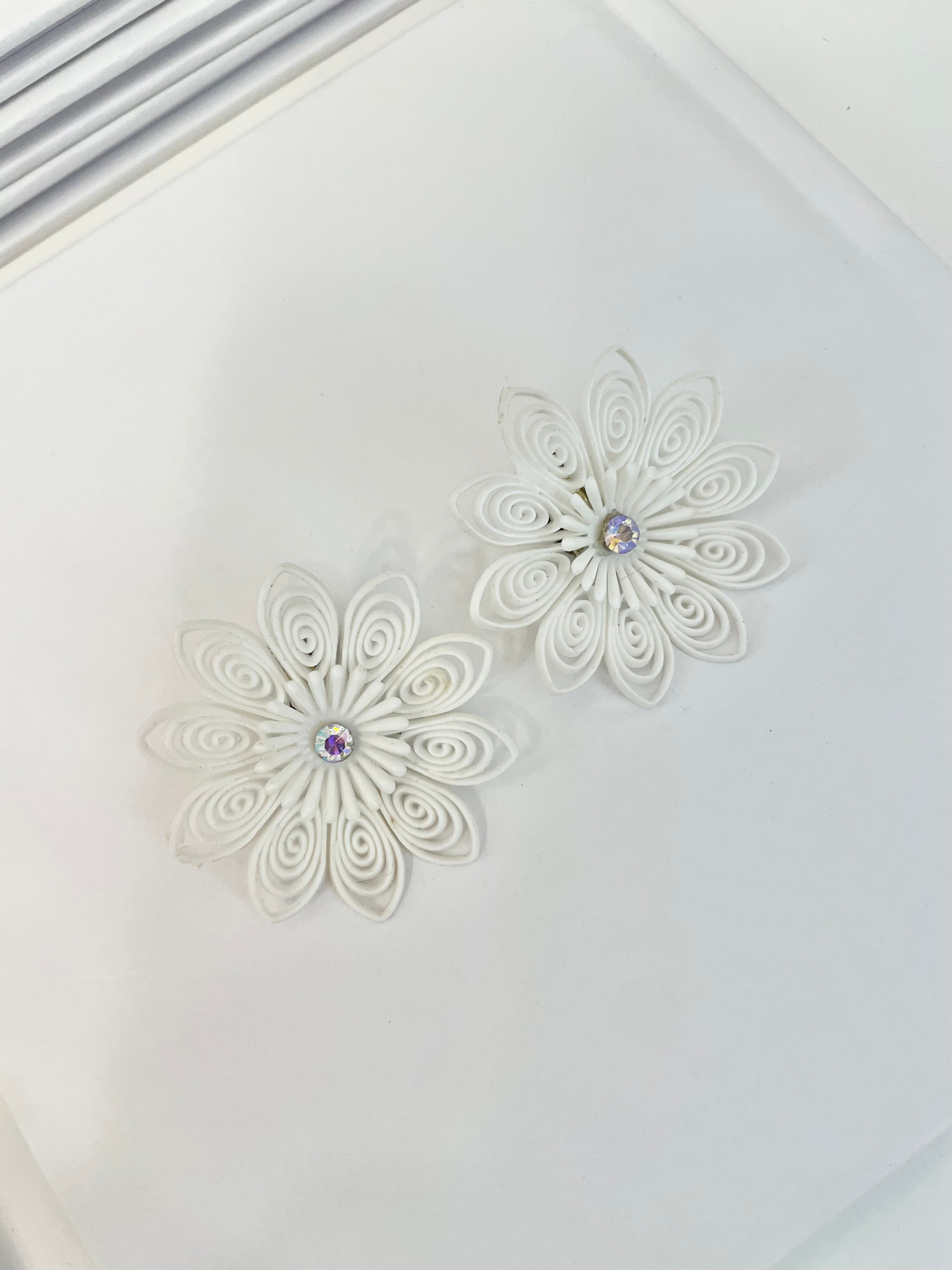 She just loves flowers... these blanc filigree resin flowers are truly divine!