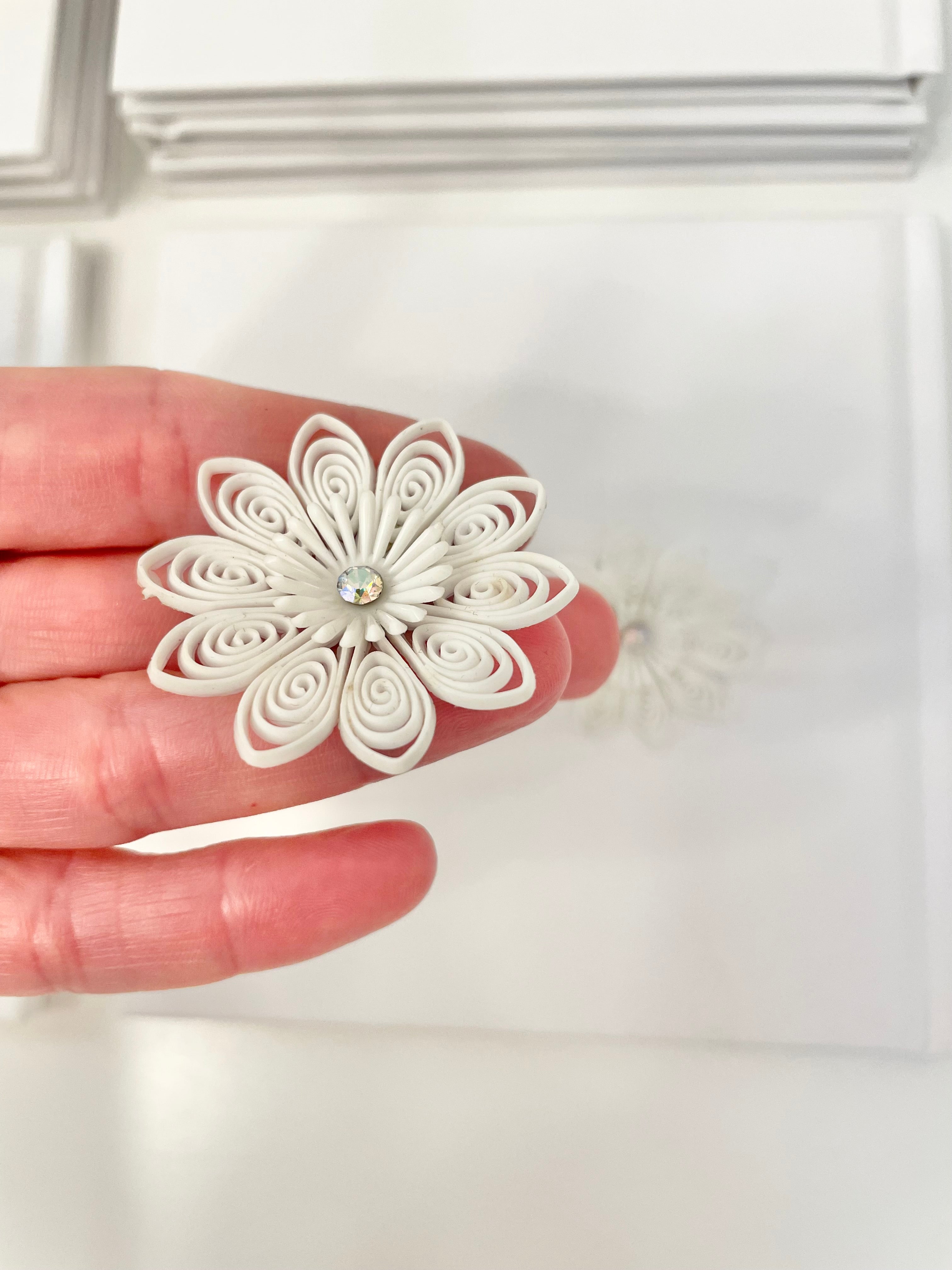 She just loves flowers... these blanc filigree resin flowers are truly divine!