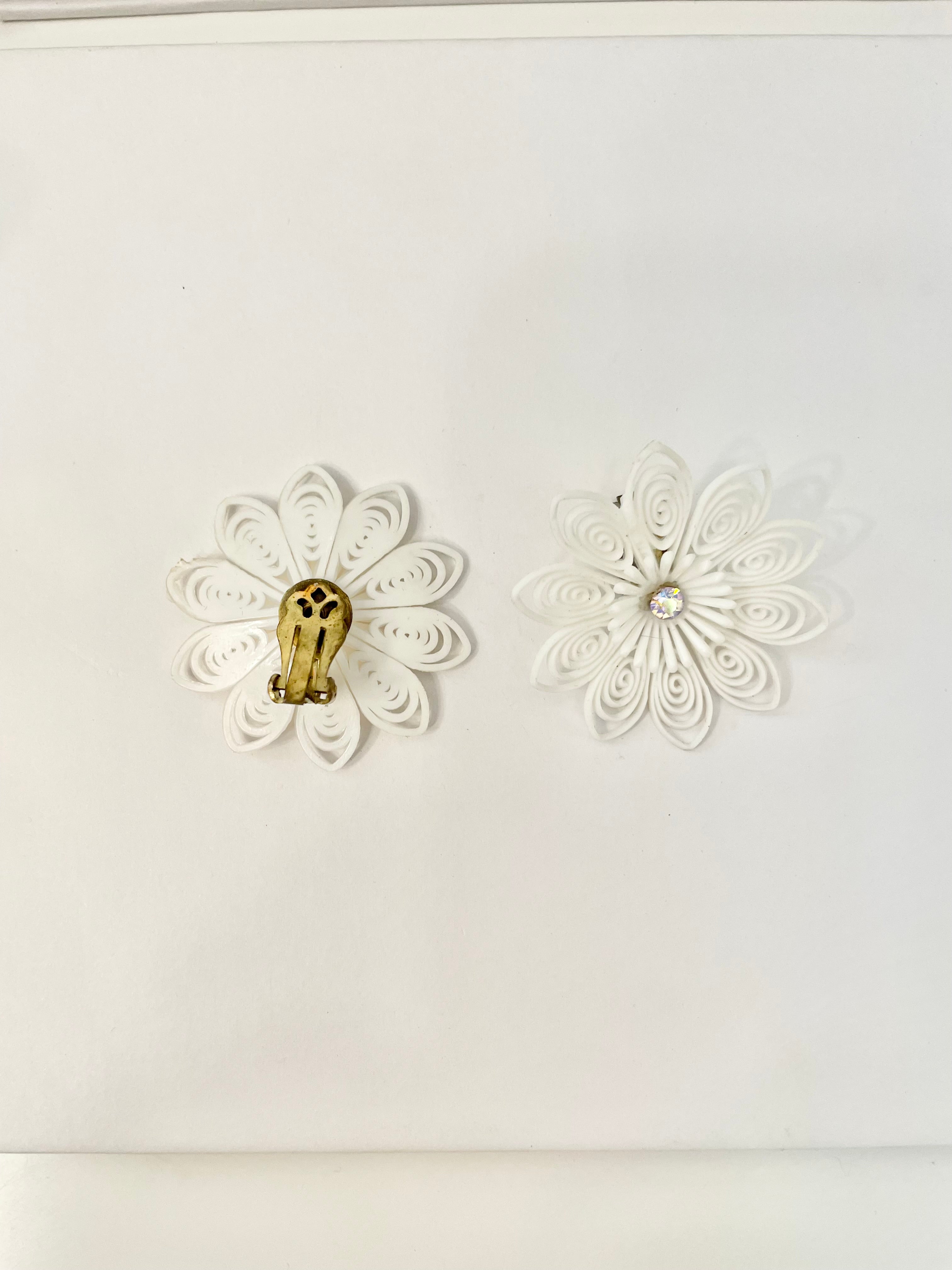 She just loves flowers... these blanc filigree resin flowers are truly divine!