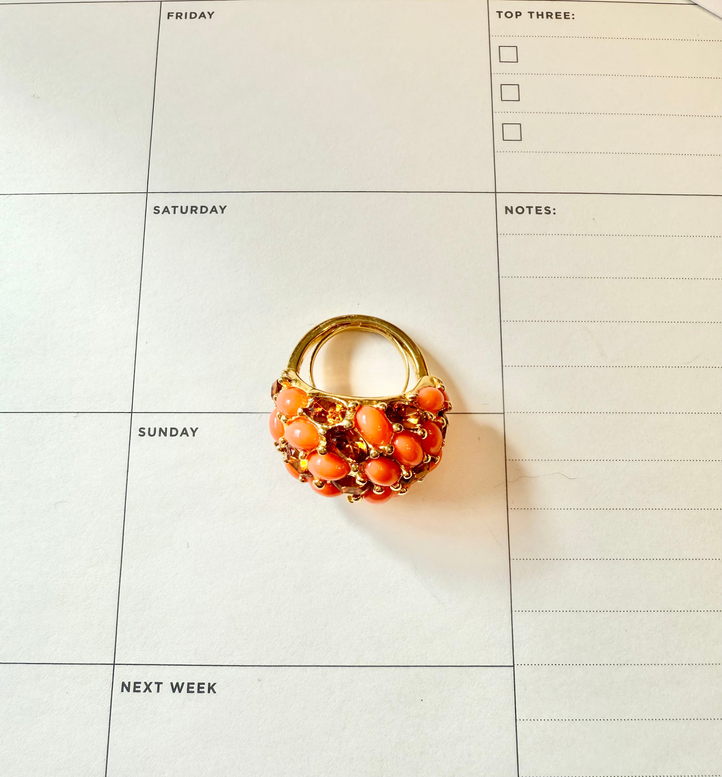 A classy Kenneth Jay Lane faux coral and orange citrine cocktail ring...