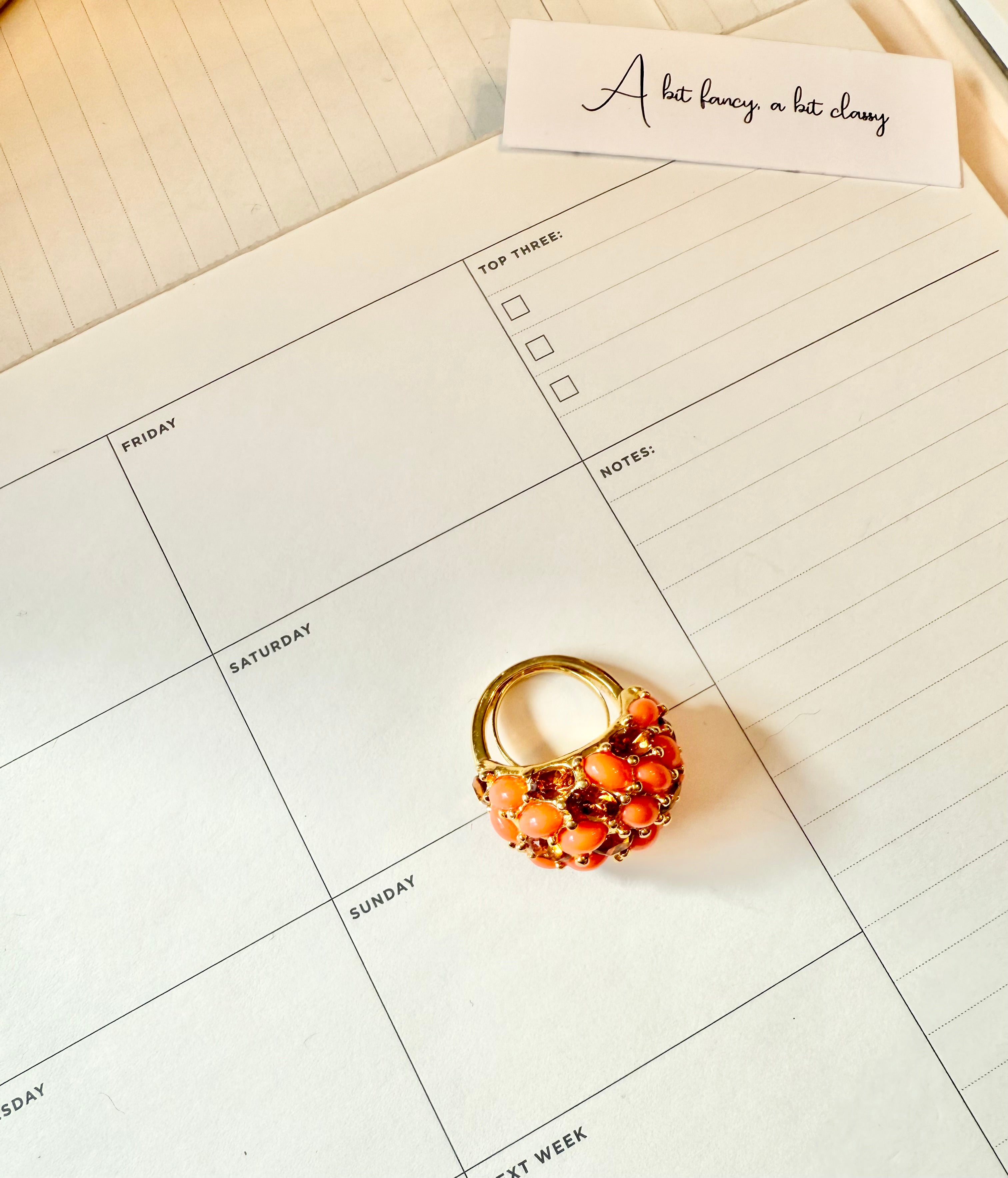 A classy Kenneth Jay Lane faux coral and orange citrine cocktail ring...