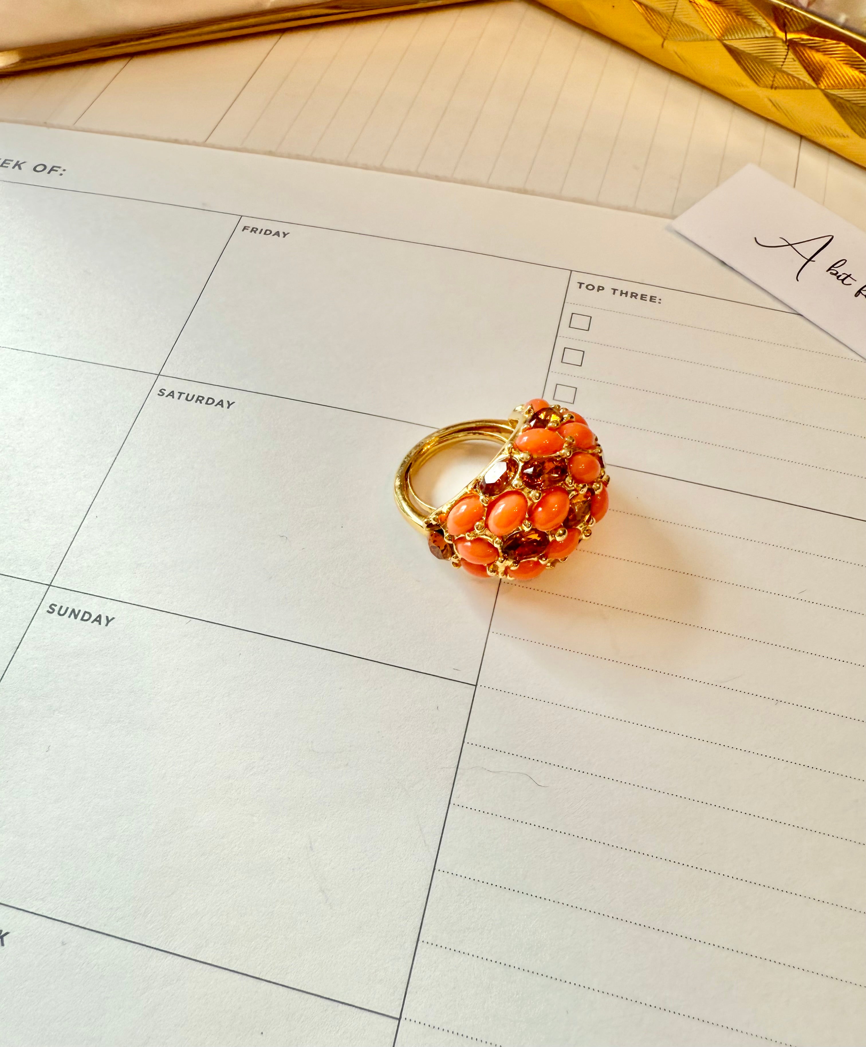 A classy Kenneth Jay Lane faux coral and orange citrine cocktail ring...