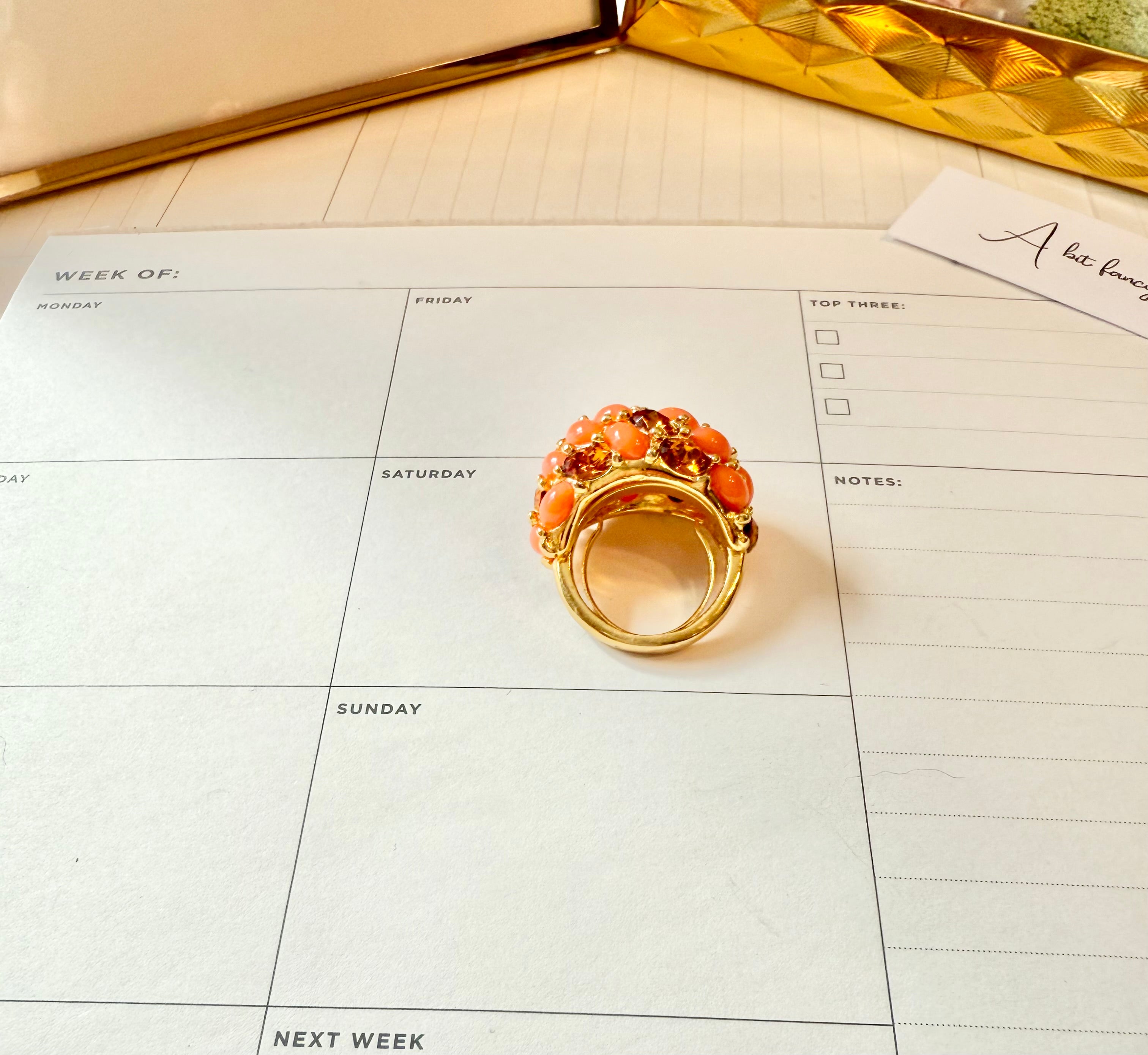 A classy Kenneth Jay Lane faux coral and orange citrine cocktail ring...