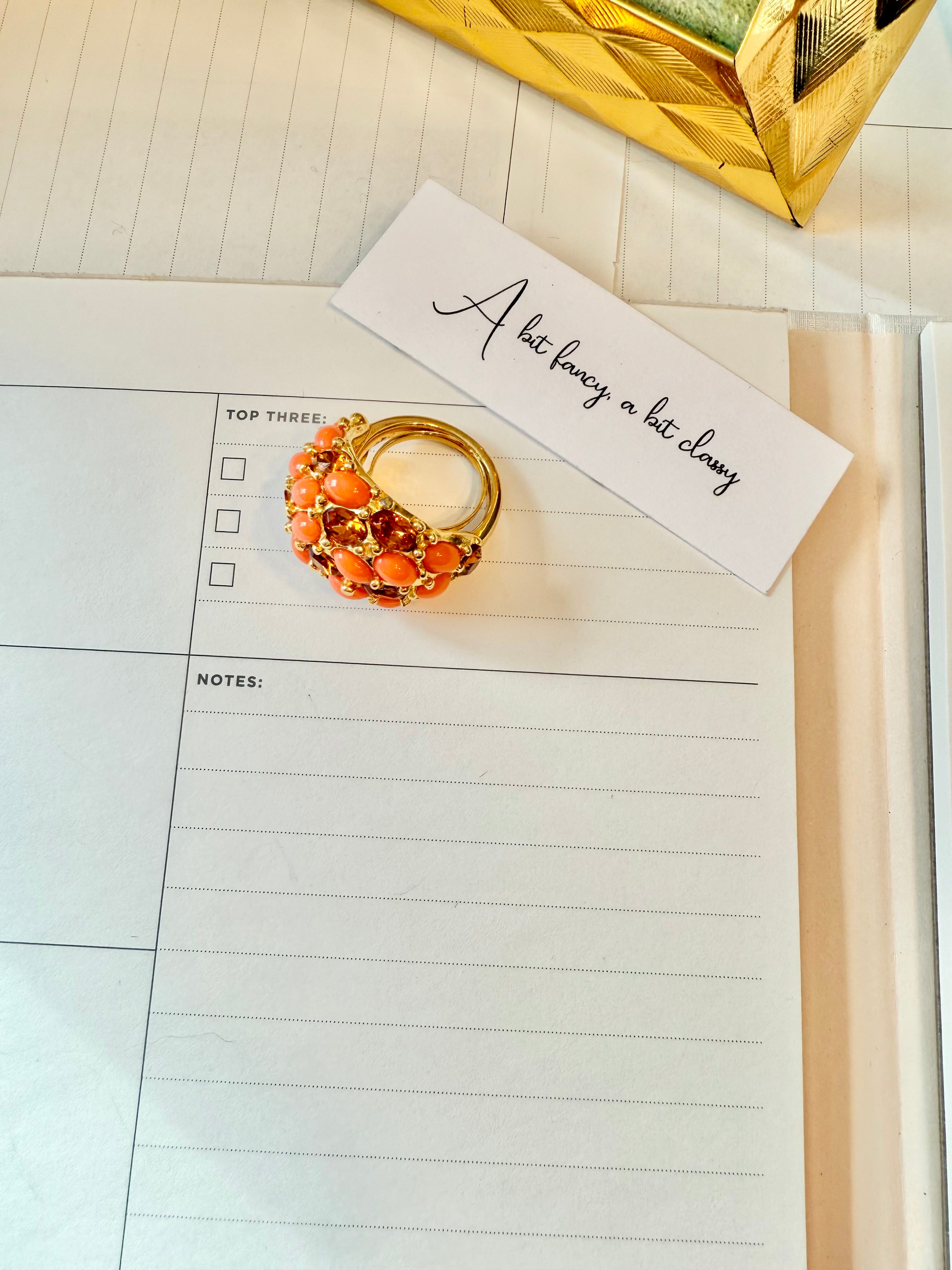 A classy Kenneth Jay Lane faux coral and orange citrine cocktail ring...