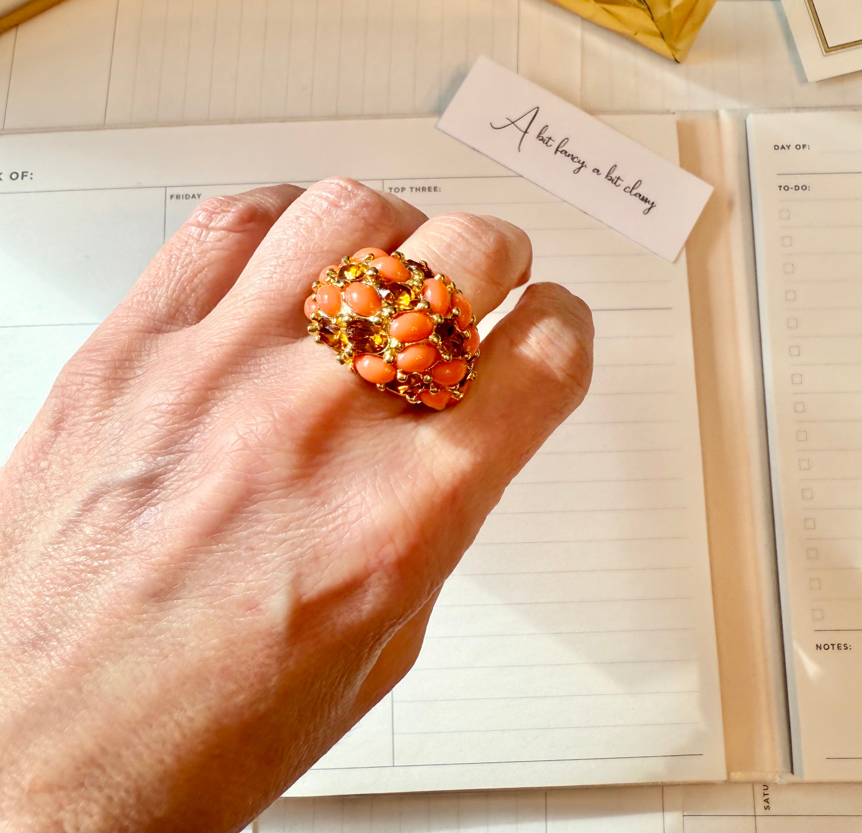 A classy Kenneth Jay Lane faux coral and orange citrine cocktail ring...