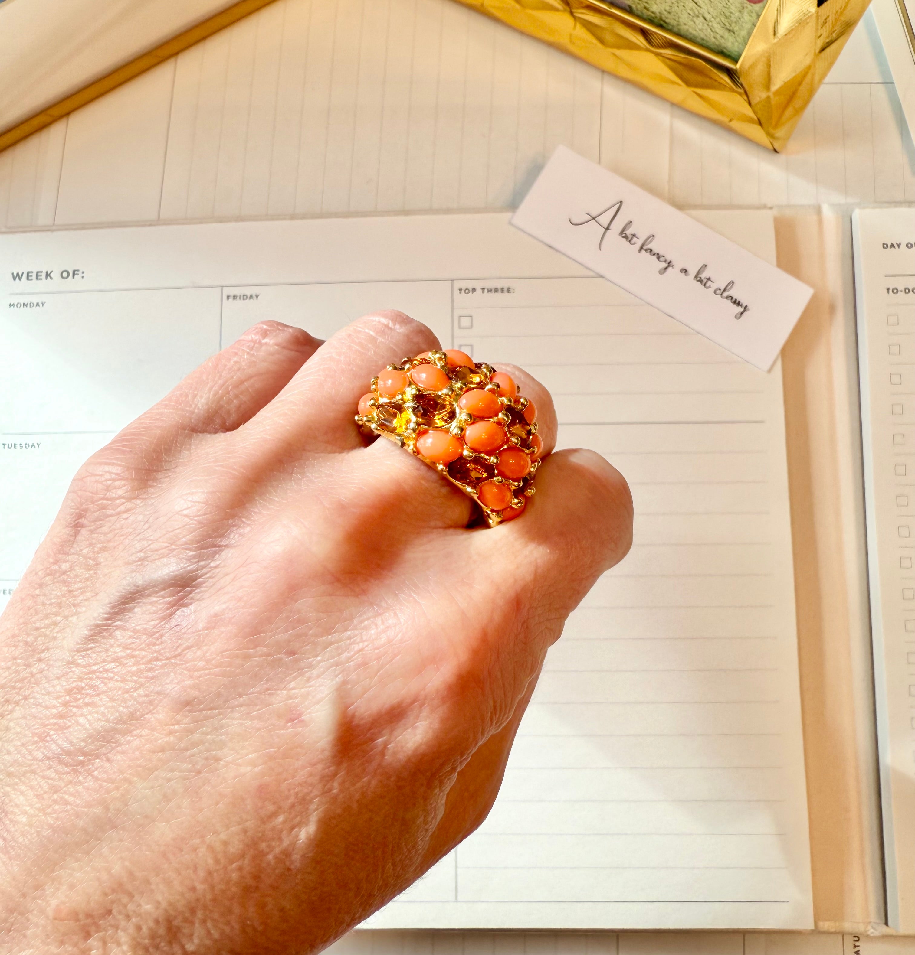 A classy Kenneth Jay Lane faux coral and orange citrine cocktail ring...