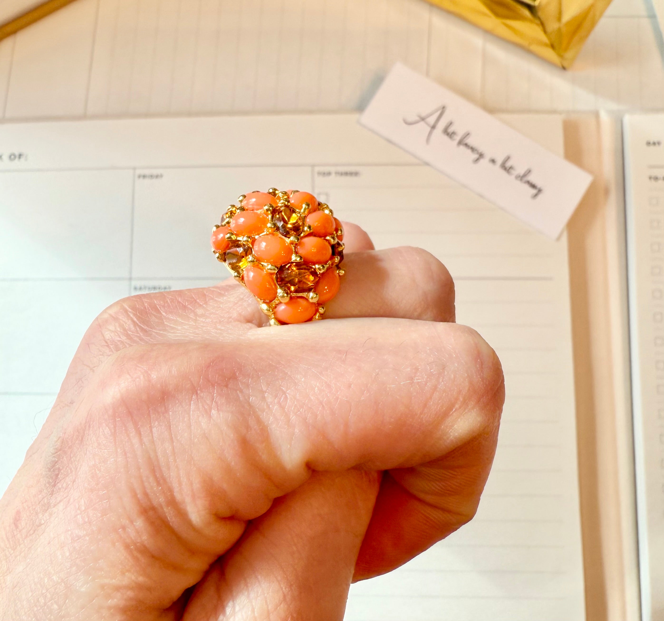 A classy Kenneth Jay Lane faux coral and orange citrine cocktail ring...