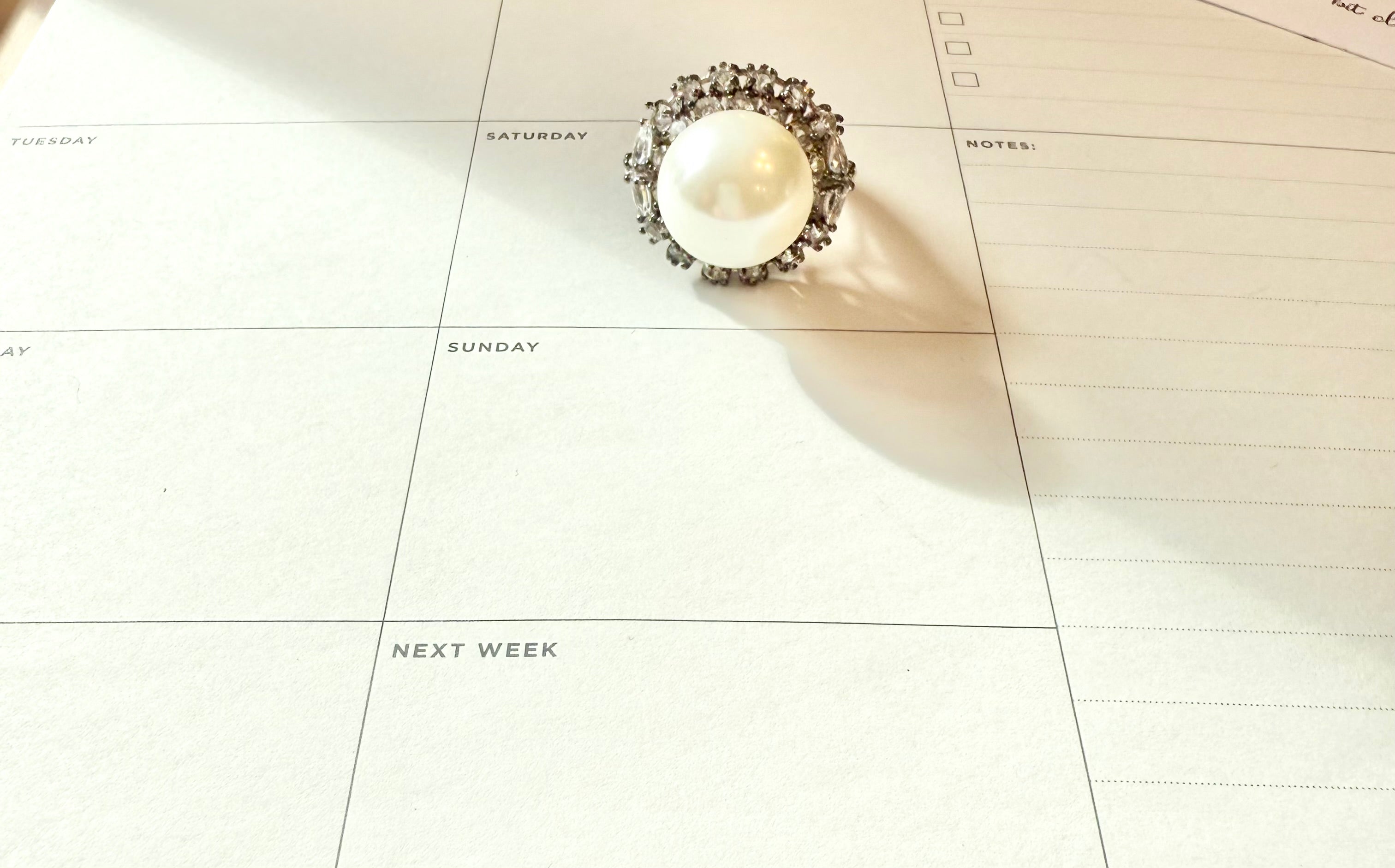 The most divine faux pearl, and white topaz cocktail ring.... elegance