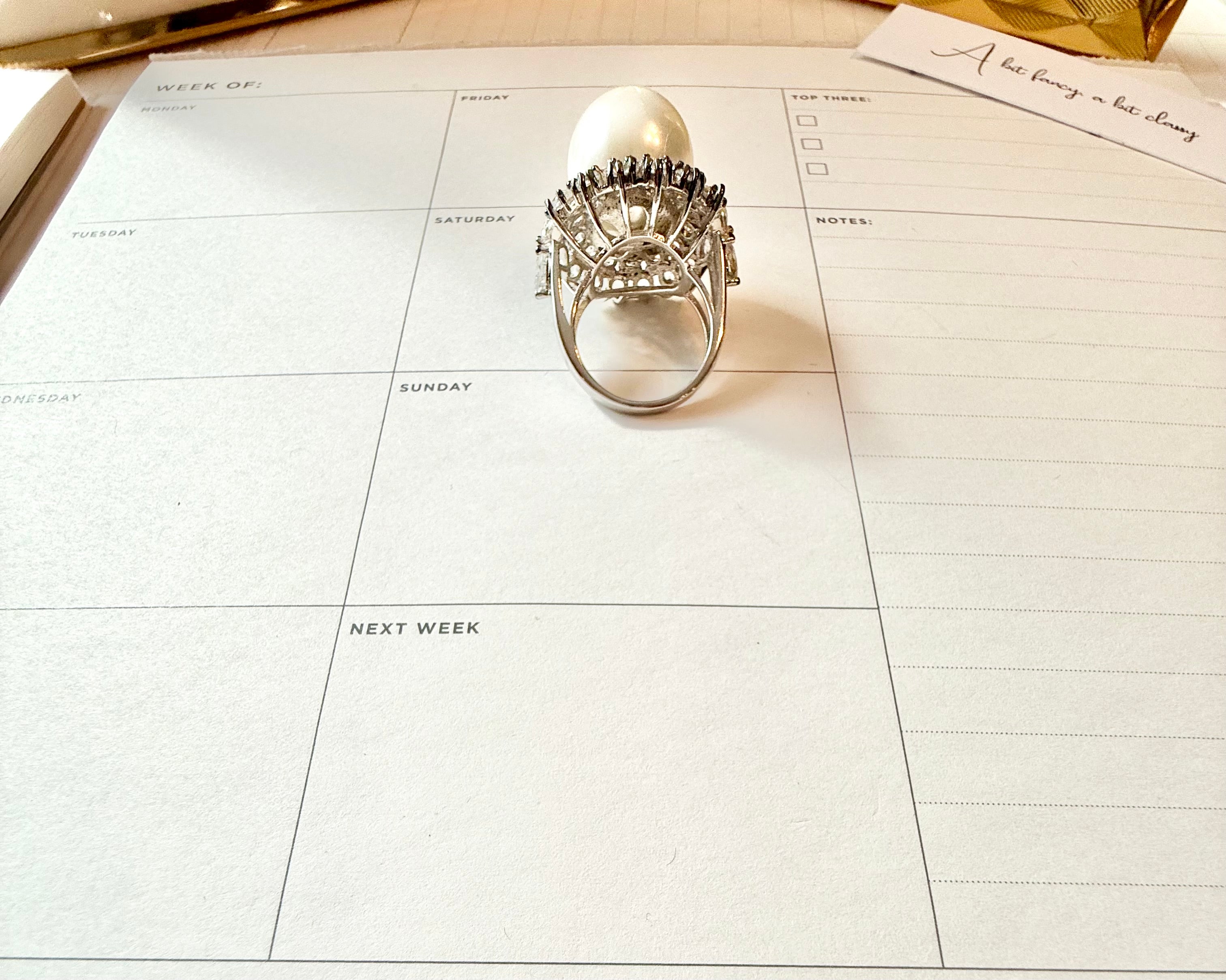 The most divine faux pearl, and white topaz cocktail ring.... elegance