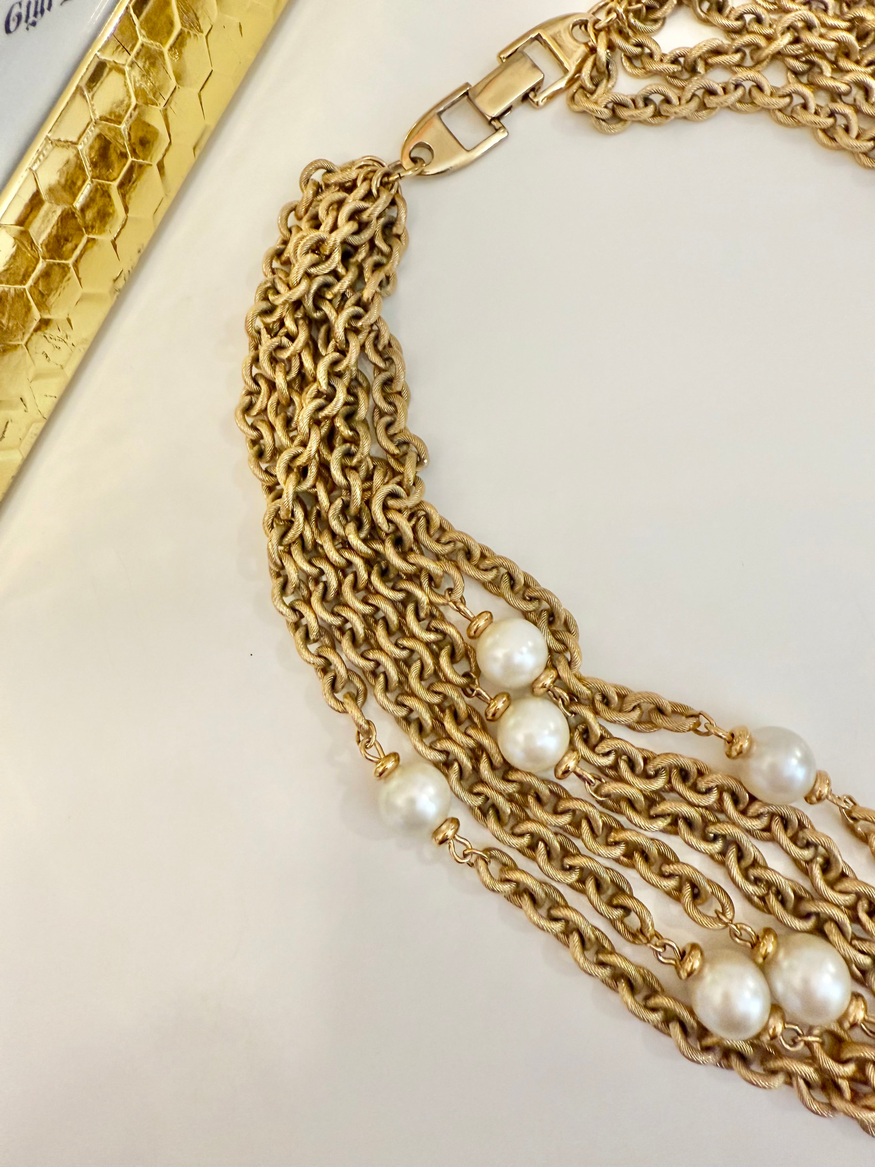 The charming gold chain and pearl necklace by Napier.