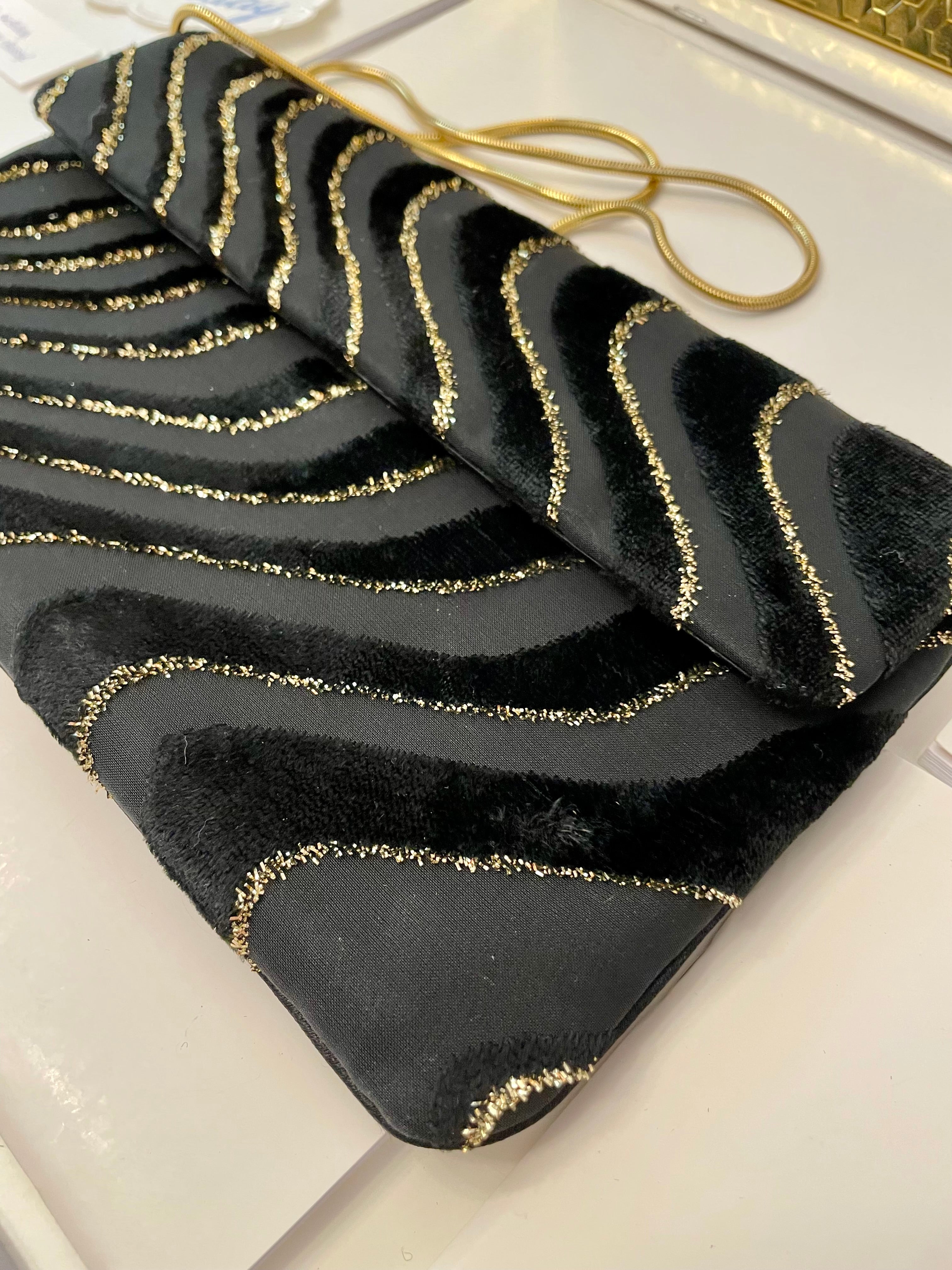 1970's dinner party noir and gold lame clutch bag.... so sassy