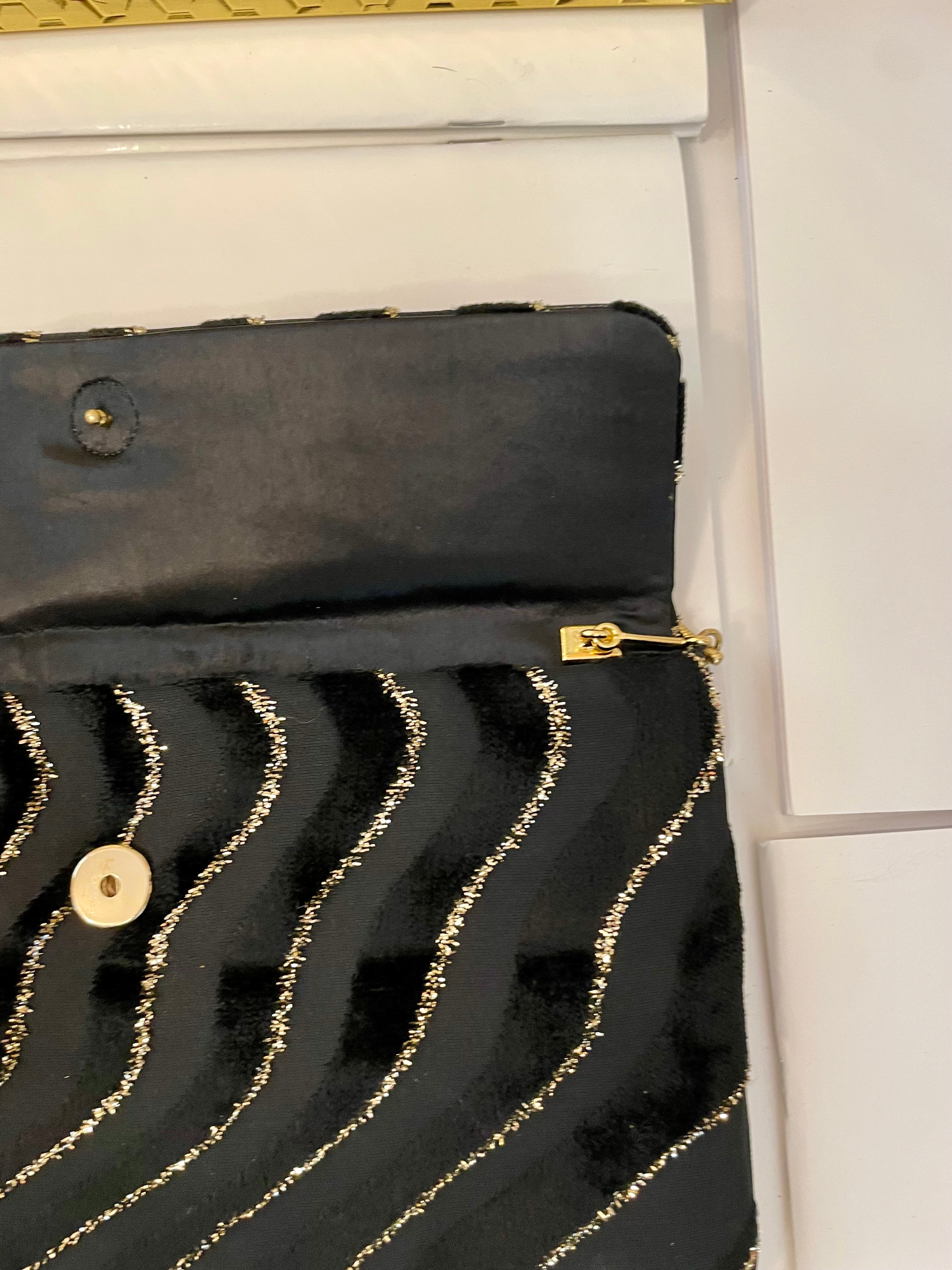 1970's dinner party noir and gold lame clutch bag.... so sassy