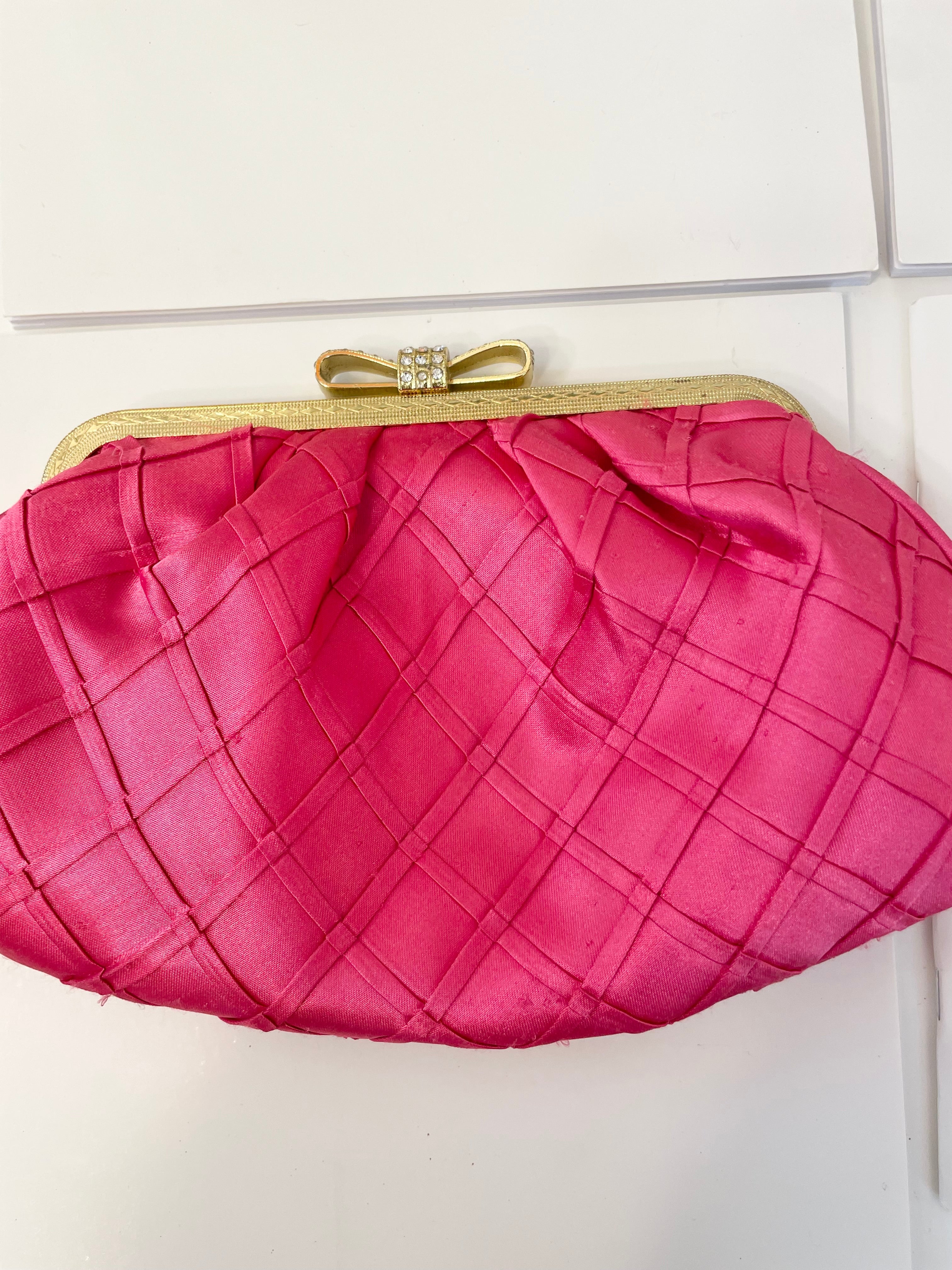 The Flirty gal loves a sassy pink satin evening bag.... so chic