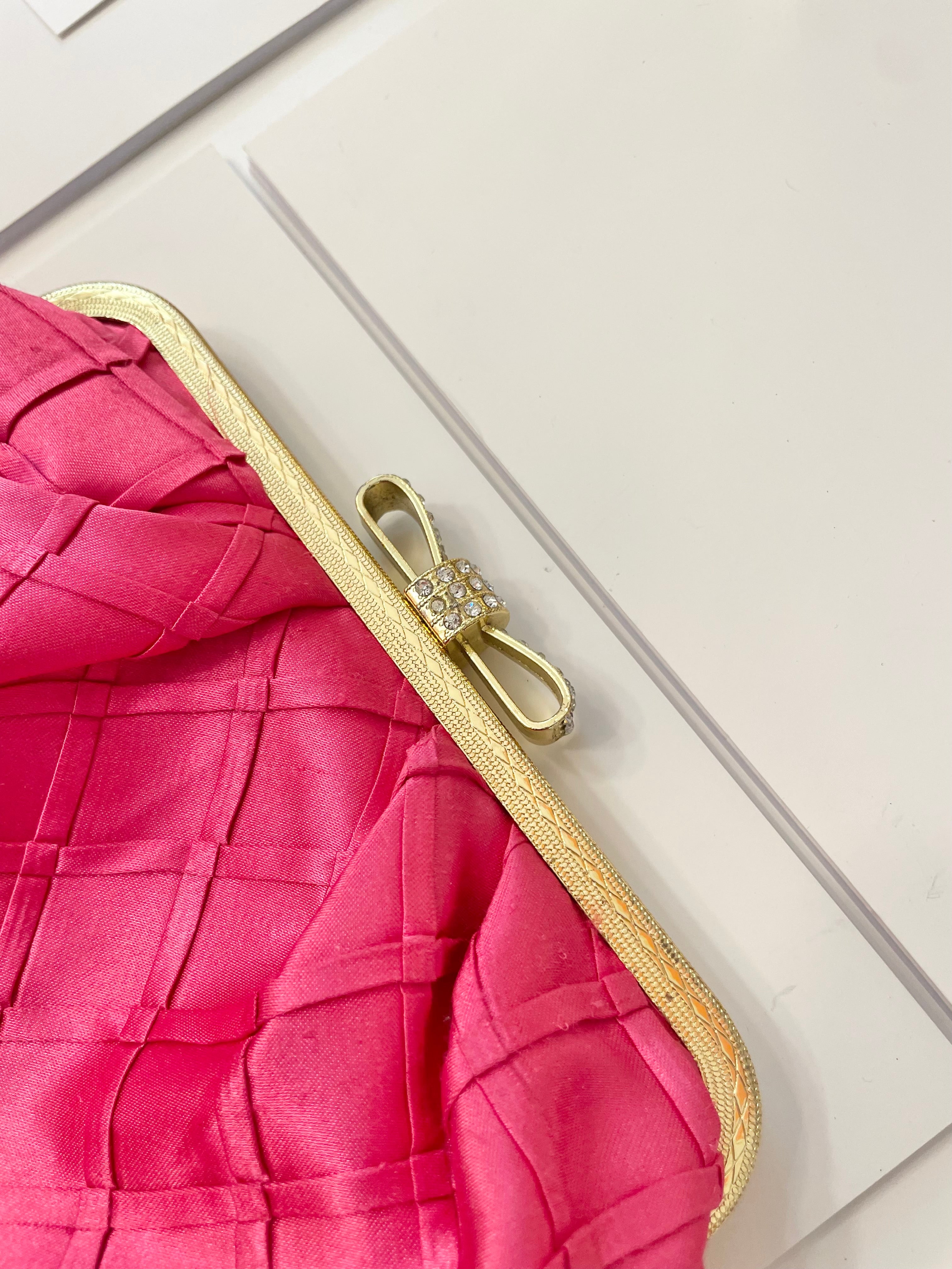 The Flirty gal loves a sassy pink satin evening bag.... so chic