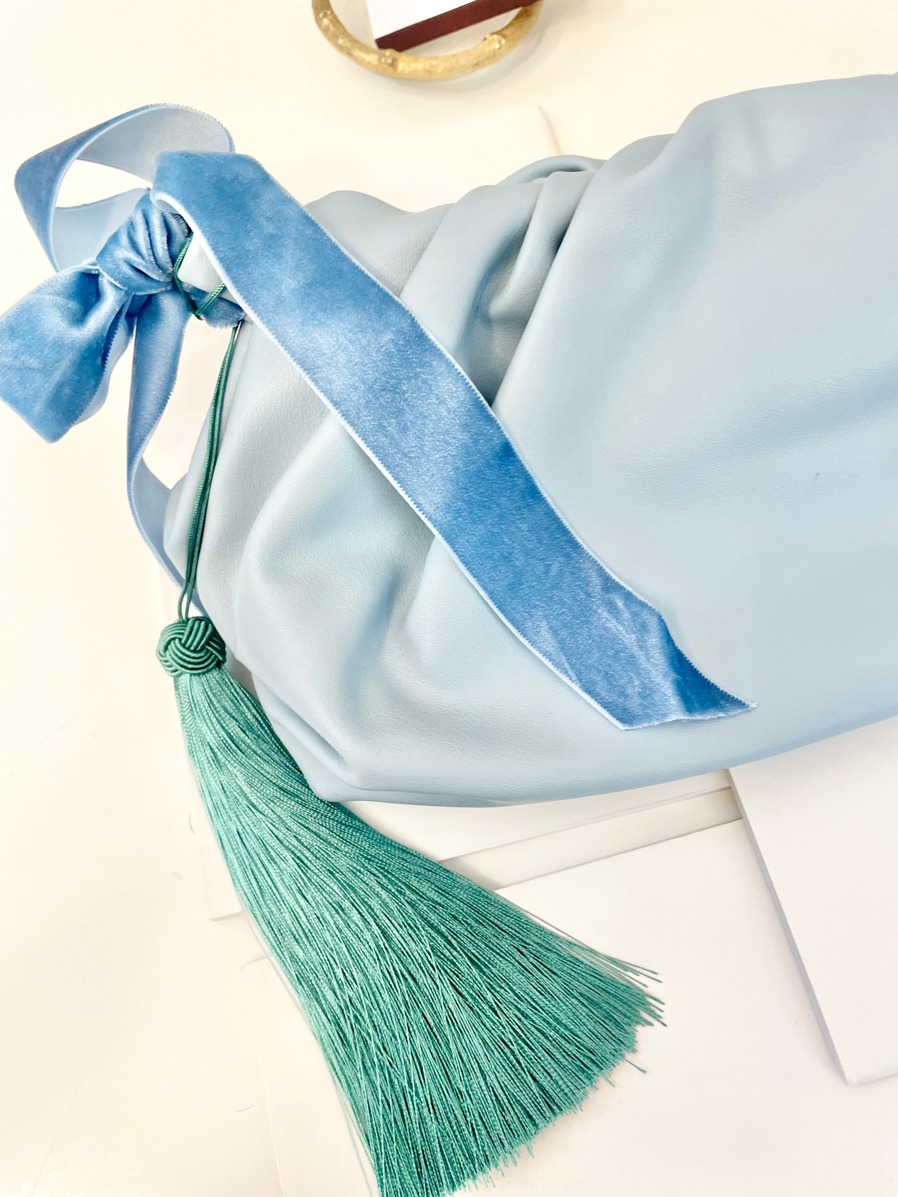 The most feminine soft blue tassel clutch bag... so lovely