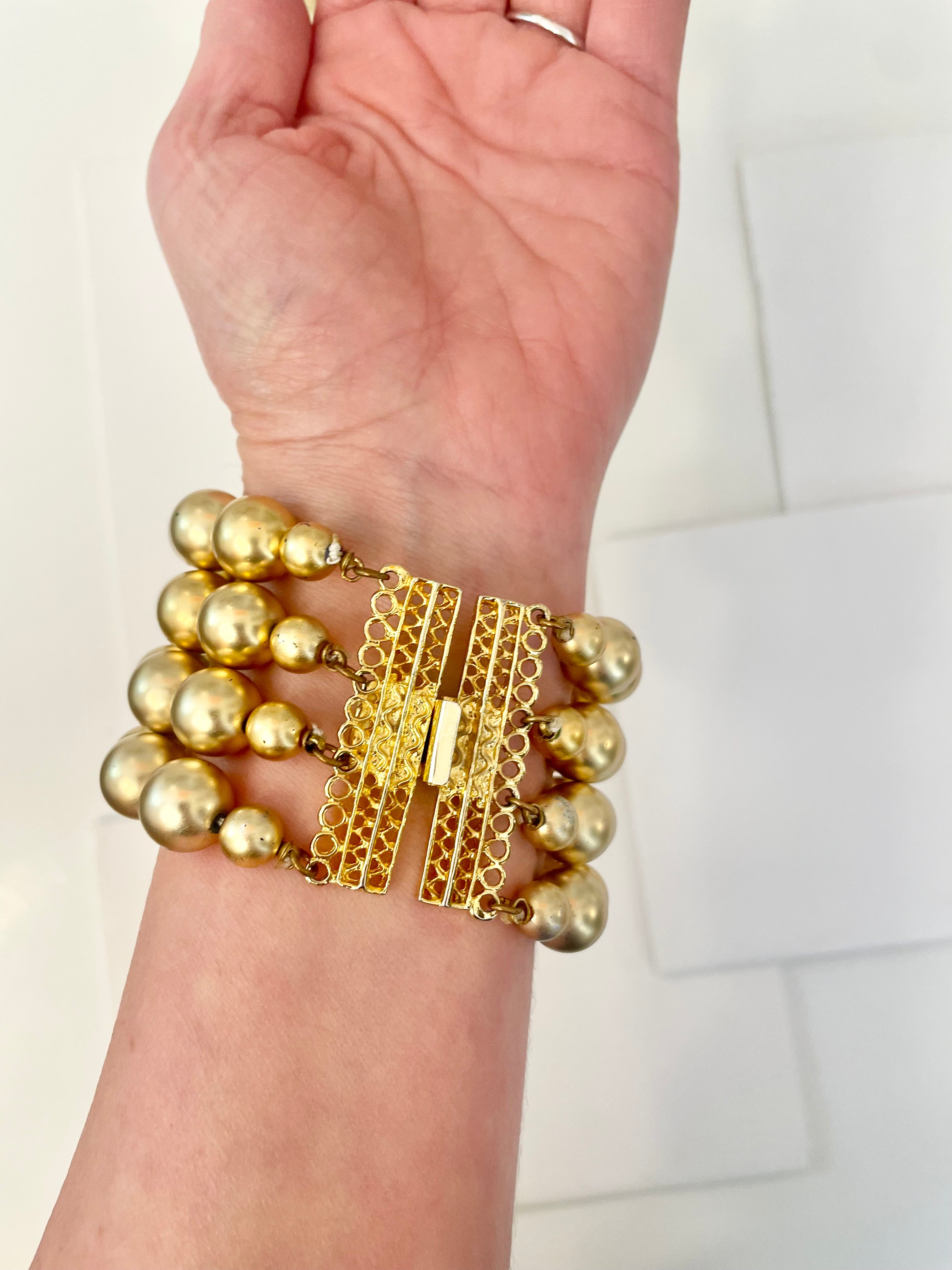 The most charming gold ball multi strand bracelet. ...so darling