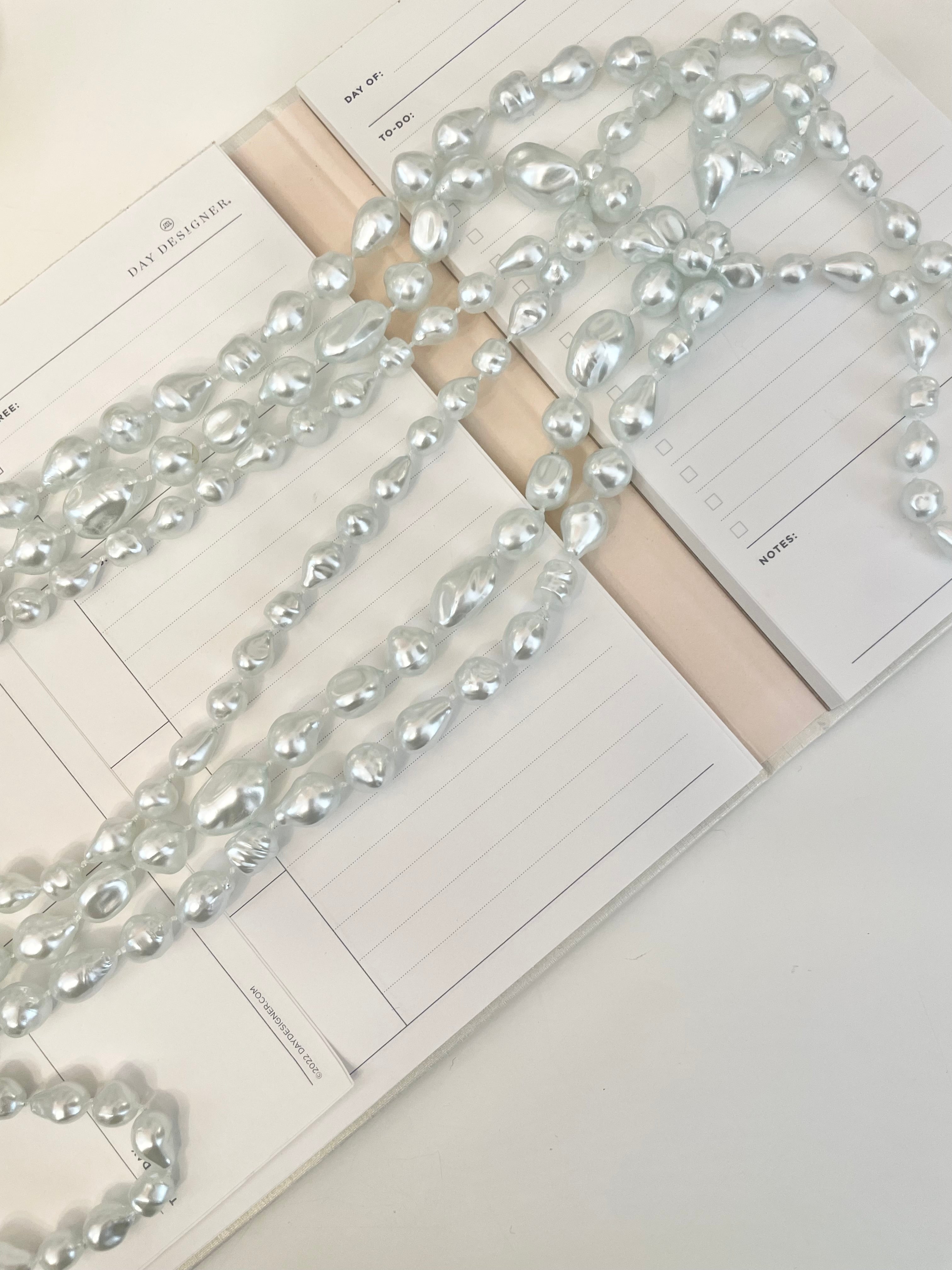 Charming multi strands of faux resin baroque pearl opera length necklaces... so lovely