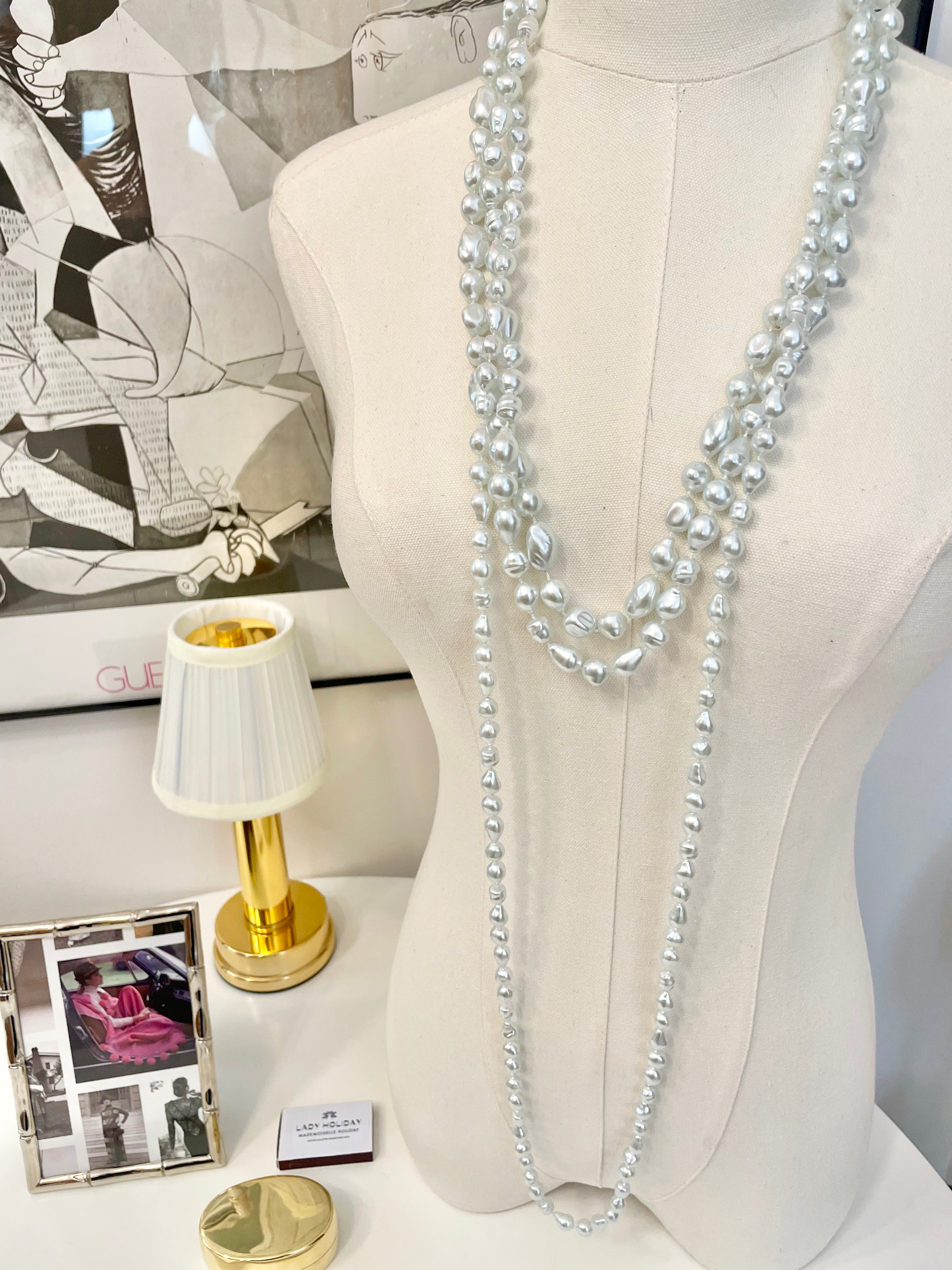 Charming multi strands of faux resin baroque pearl opera length necklaces... so lovely