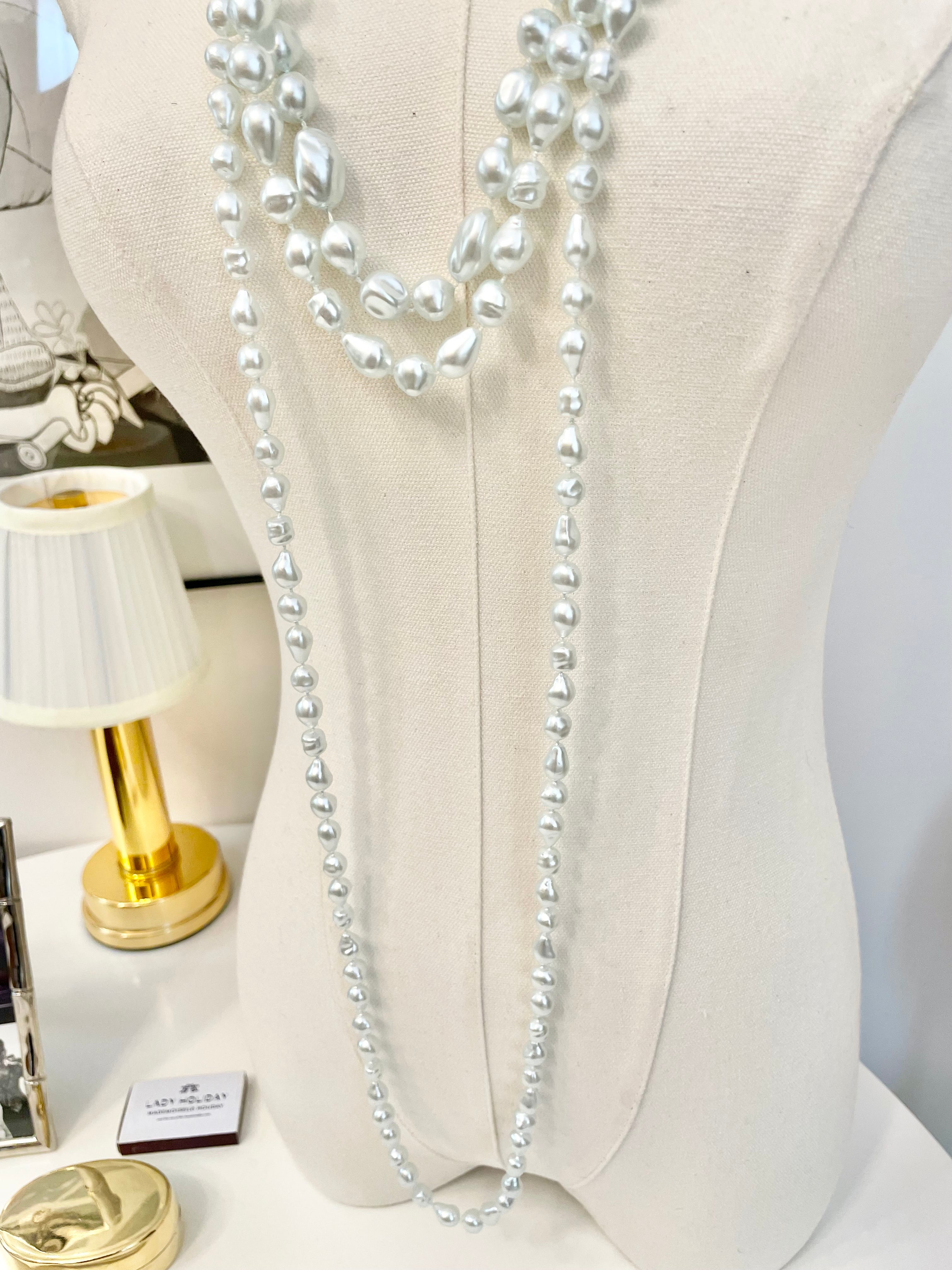 Charming multi strands of faux resin baroque pearl opera length necklaces... so lovely