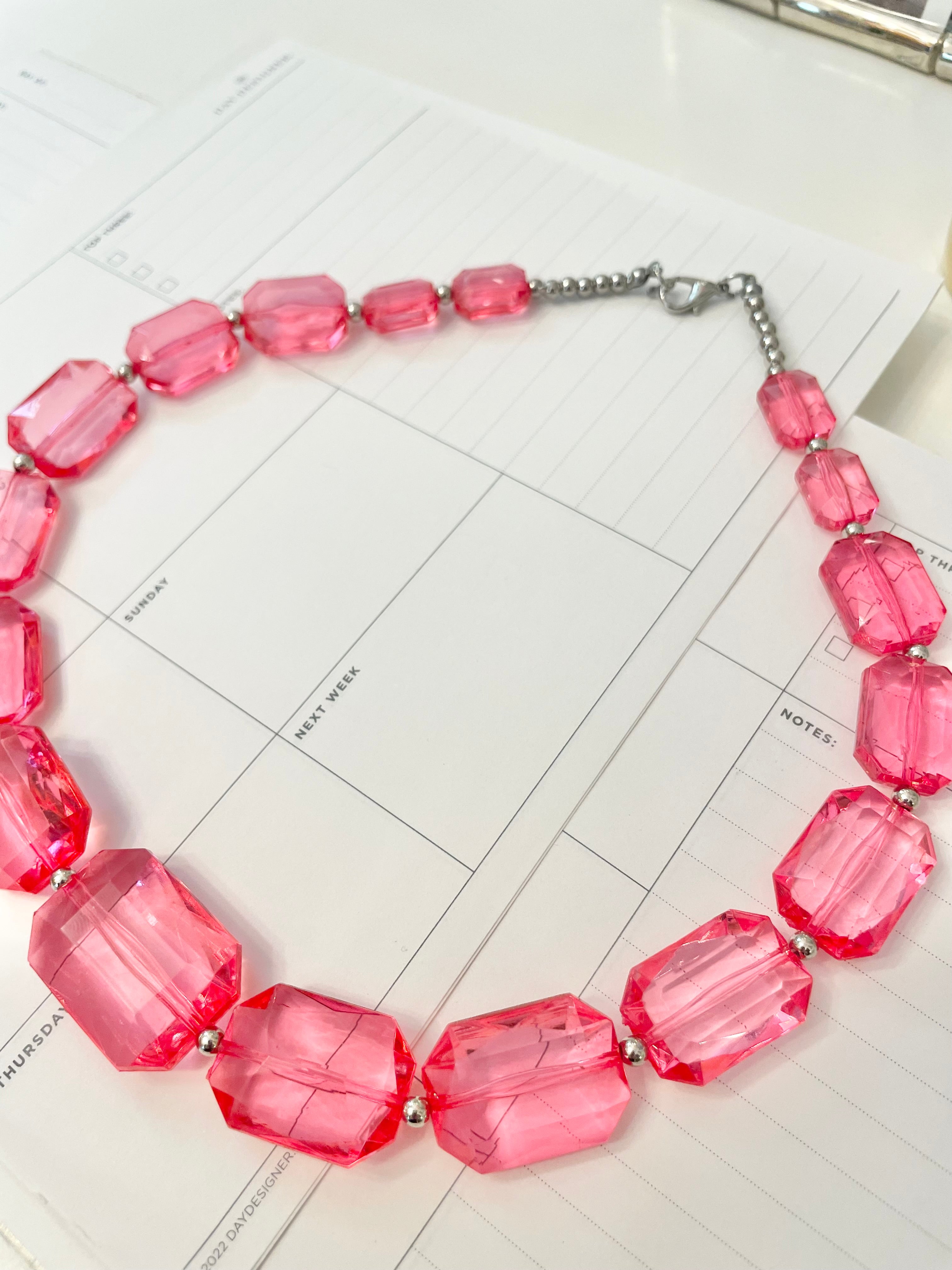 The Flirty gal is always in love with a classy pink necklace...