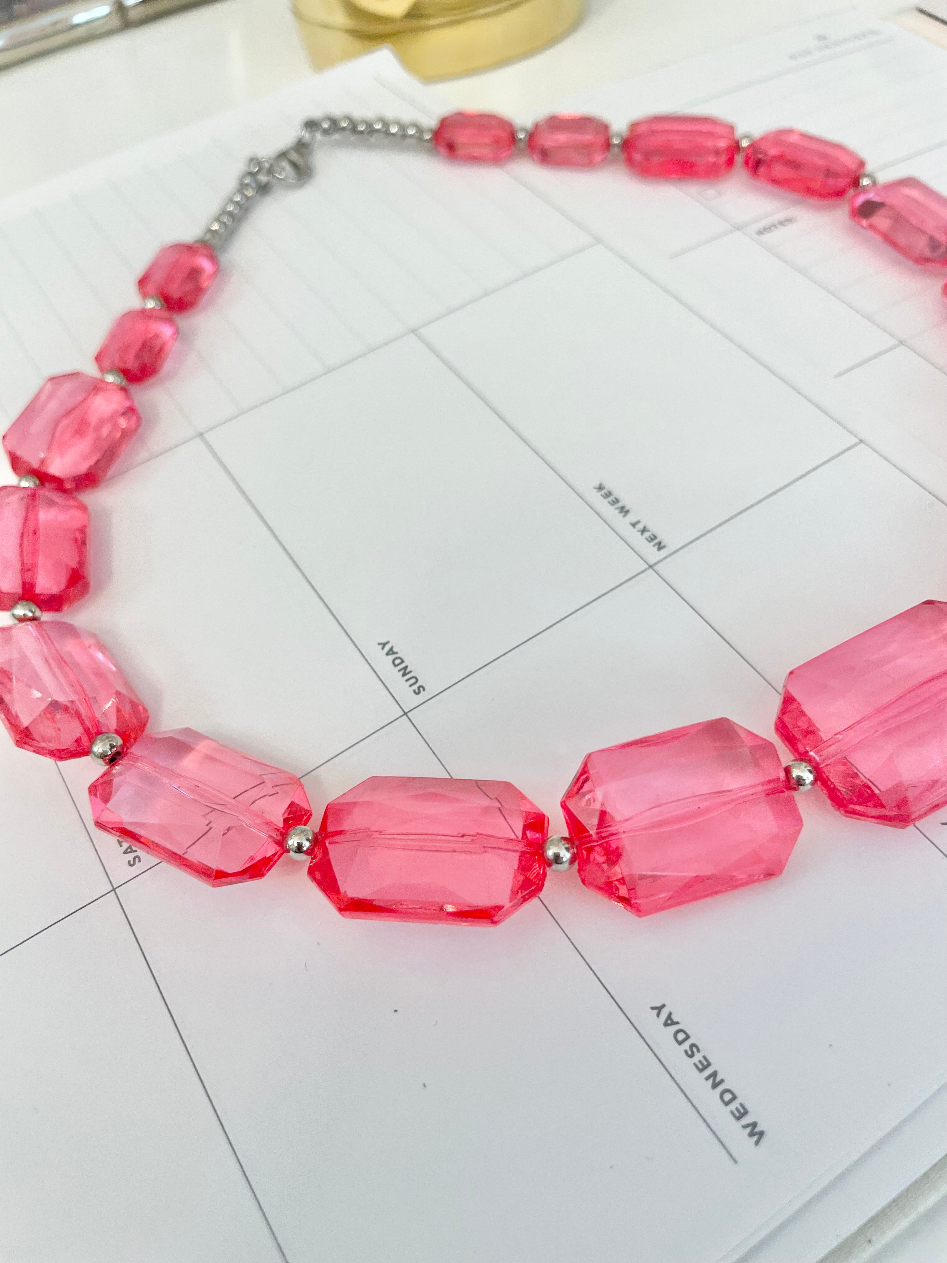 The Flirty gal is always in love with a classy pink necklace...