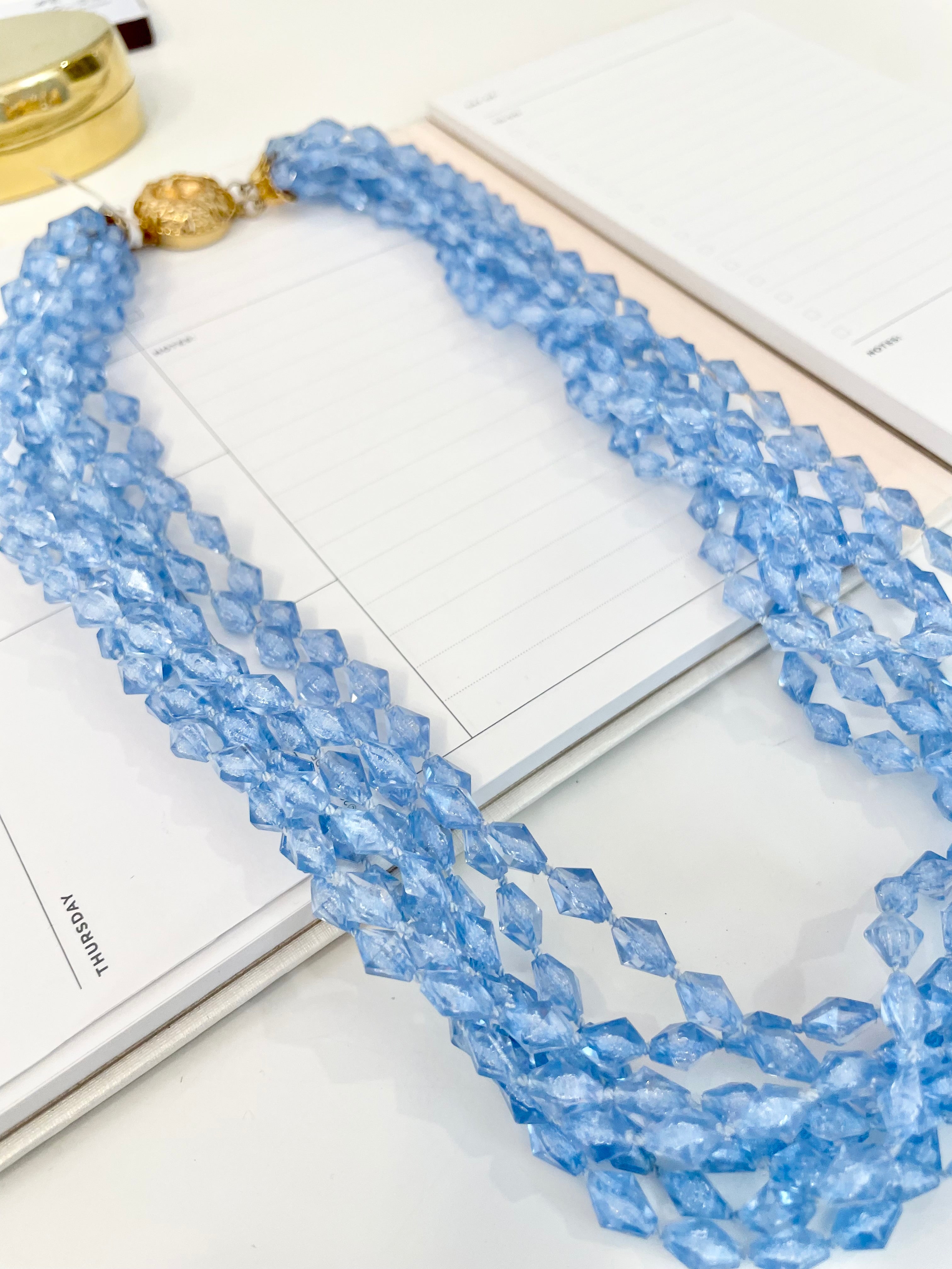 The most beautiful multi strand blue faceted resin stone necklace... so feminine!