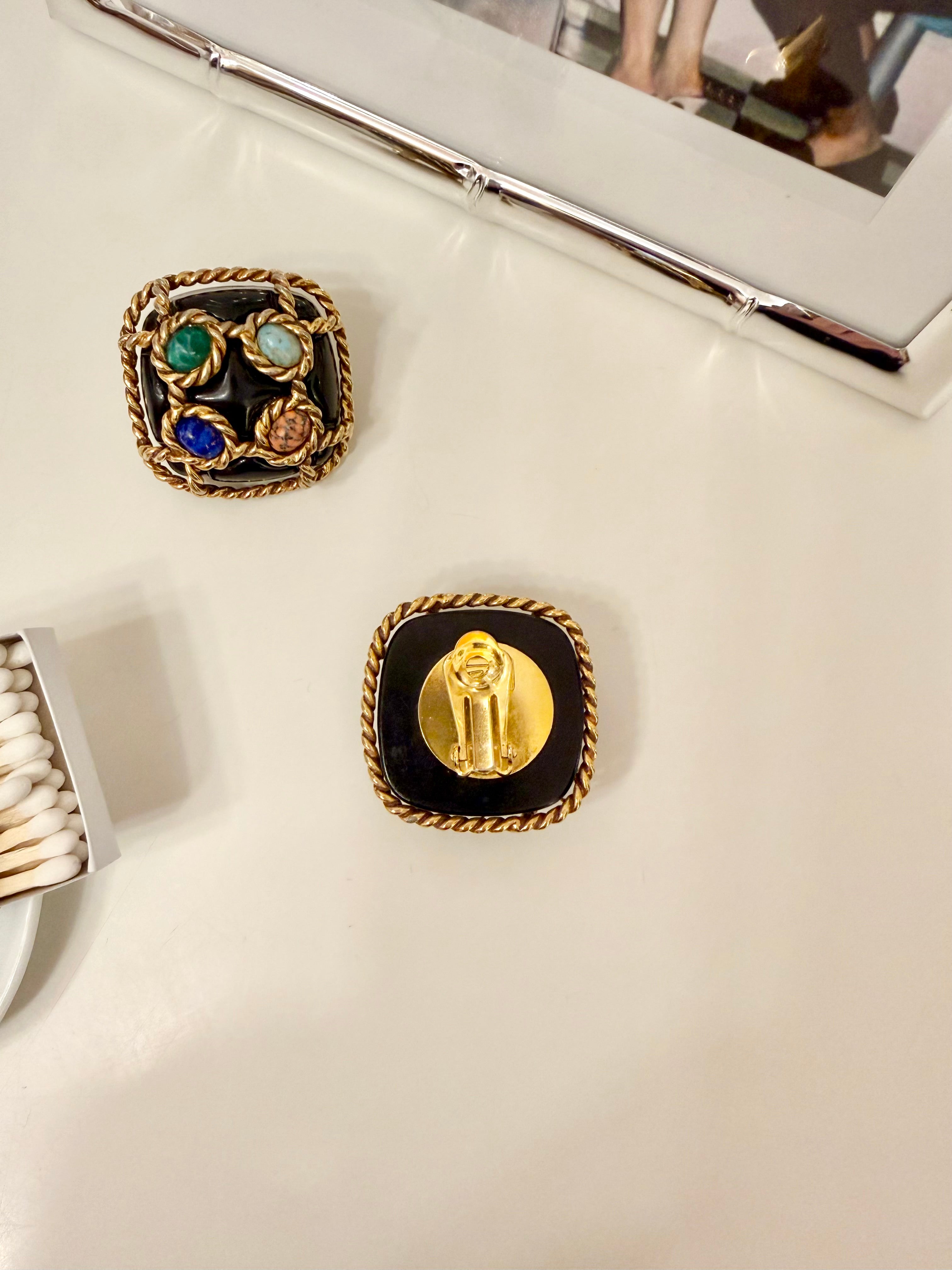 The most dramatic noir button earrings....