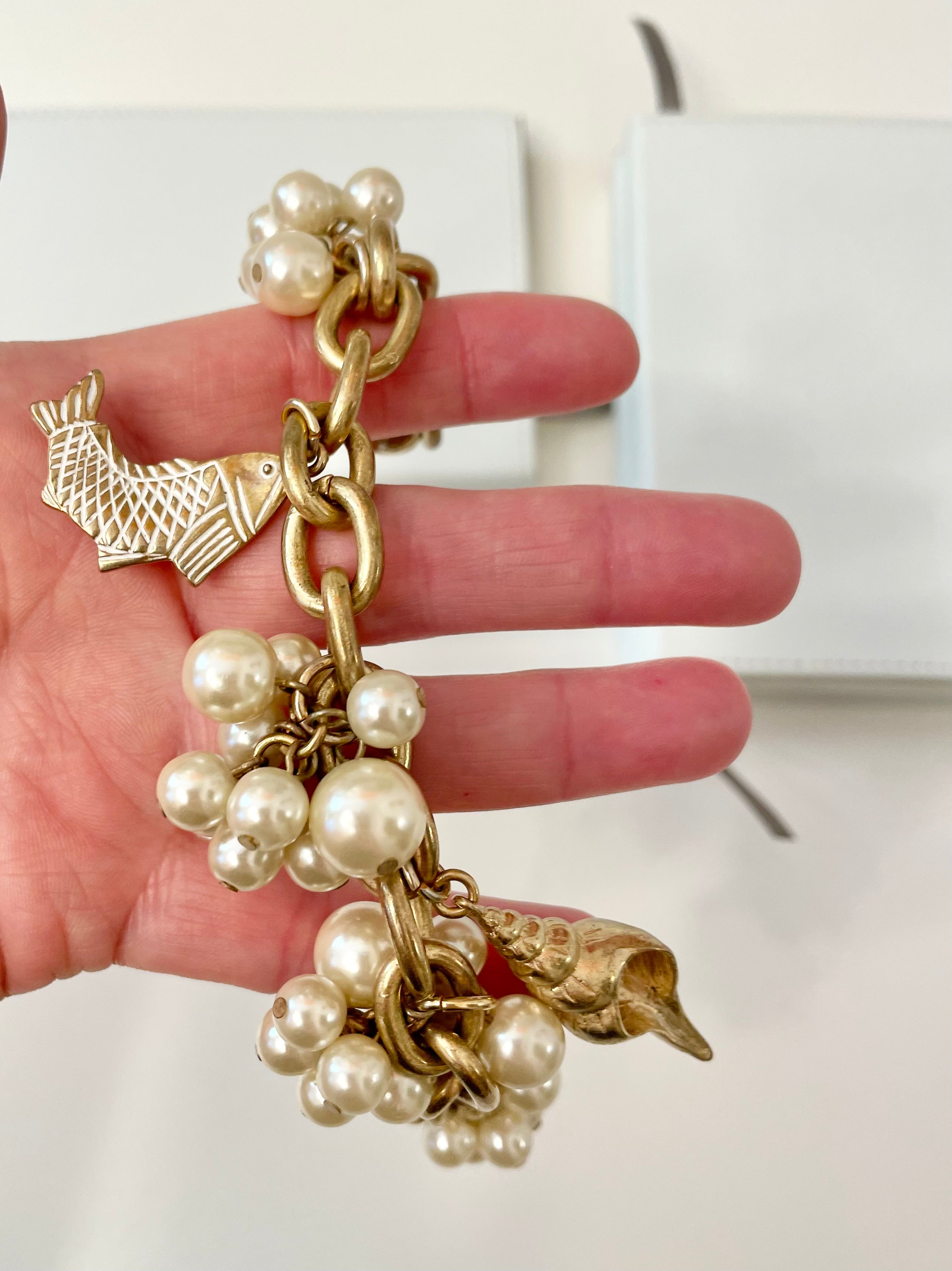 Charming figural and pearl classy charm bracelet..