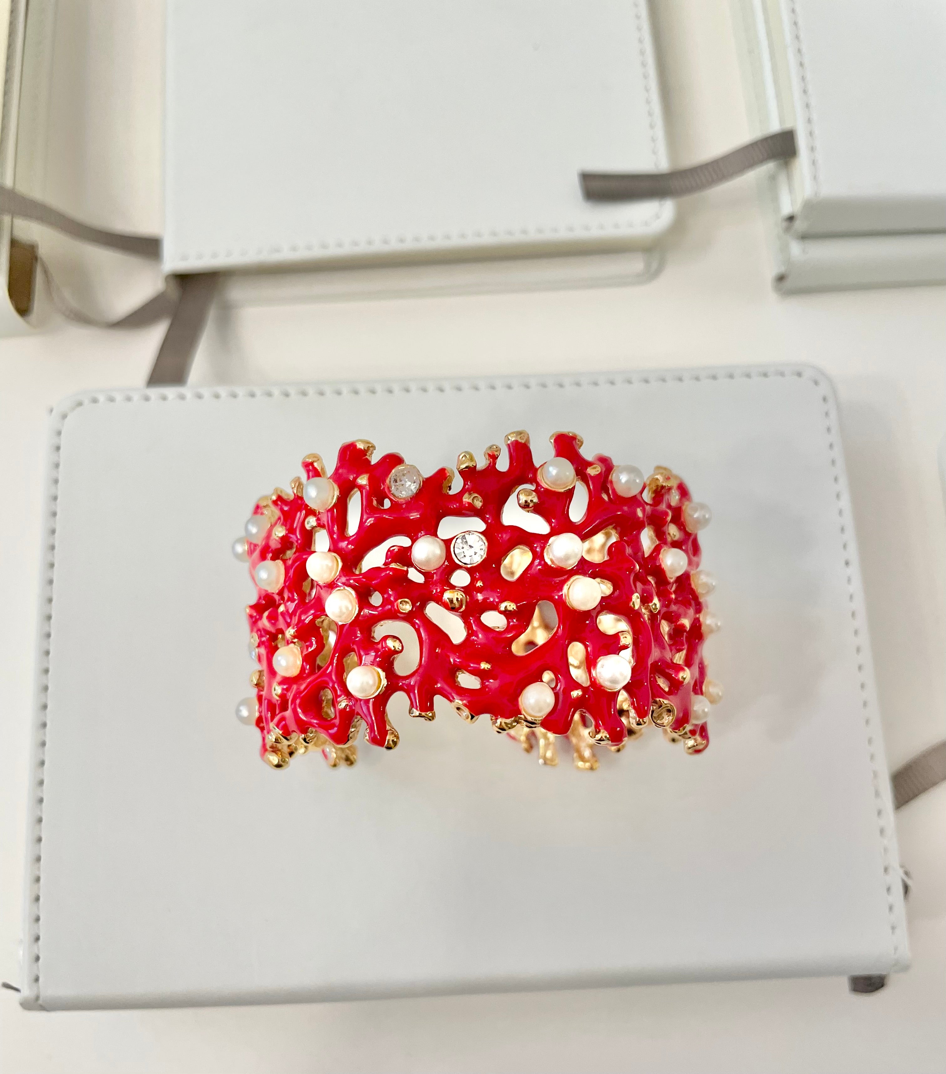 Kenneth Jay Lane, lovely coral cuff bracelet, with a dusting of pearls, and rhinestones! so chic