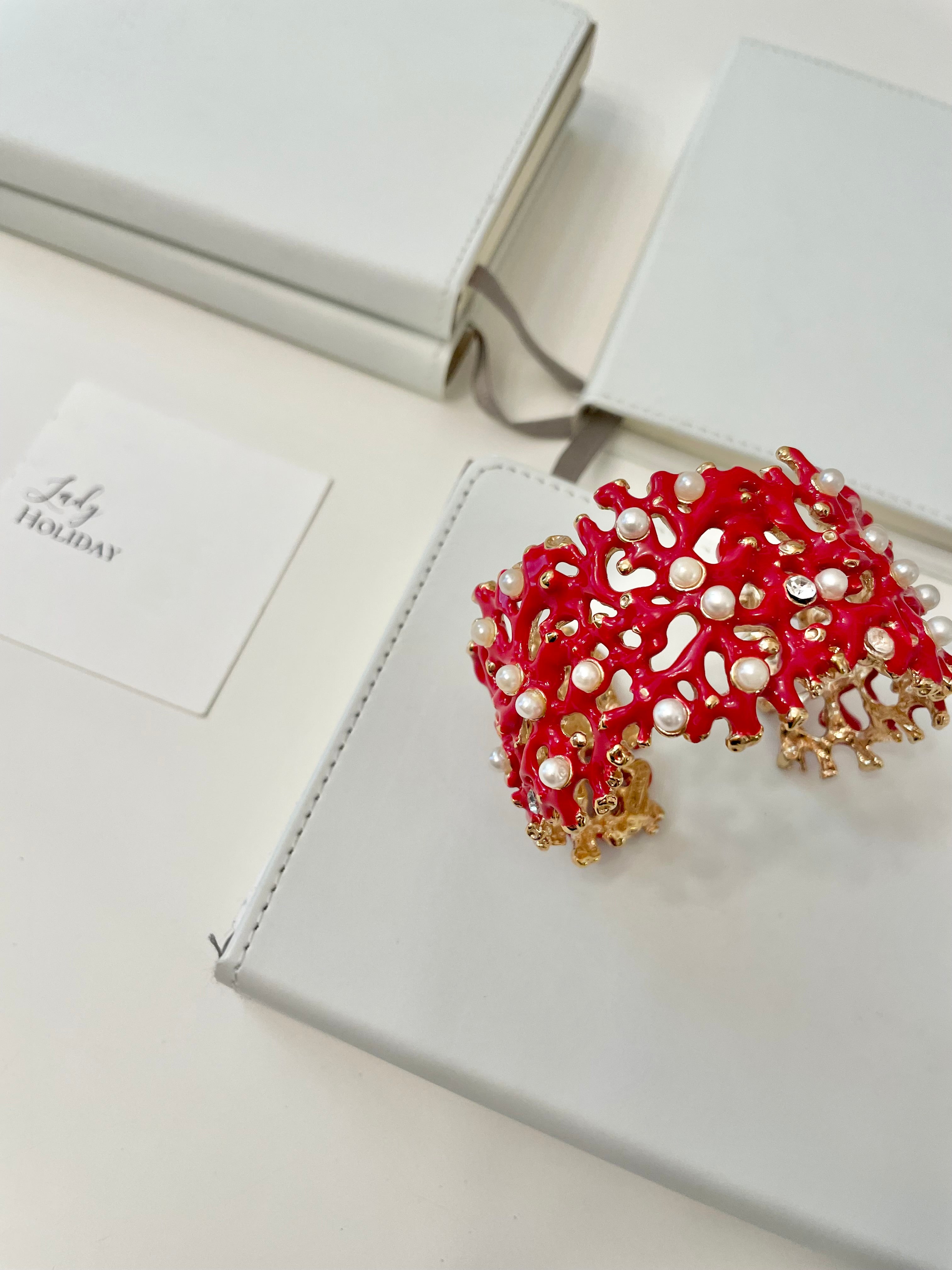 Kenneth Jay Lane, lovely coral cuff bracelet, with a dusting of pearls, and rhinestones! so chic