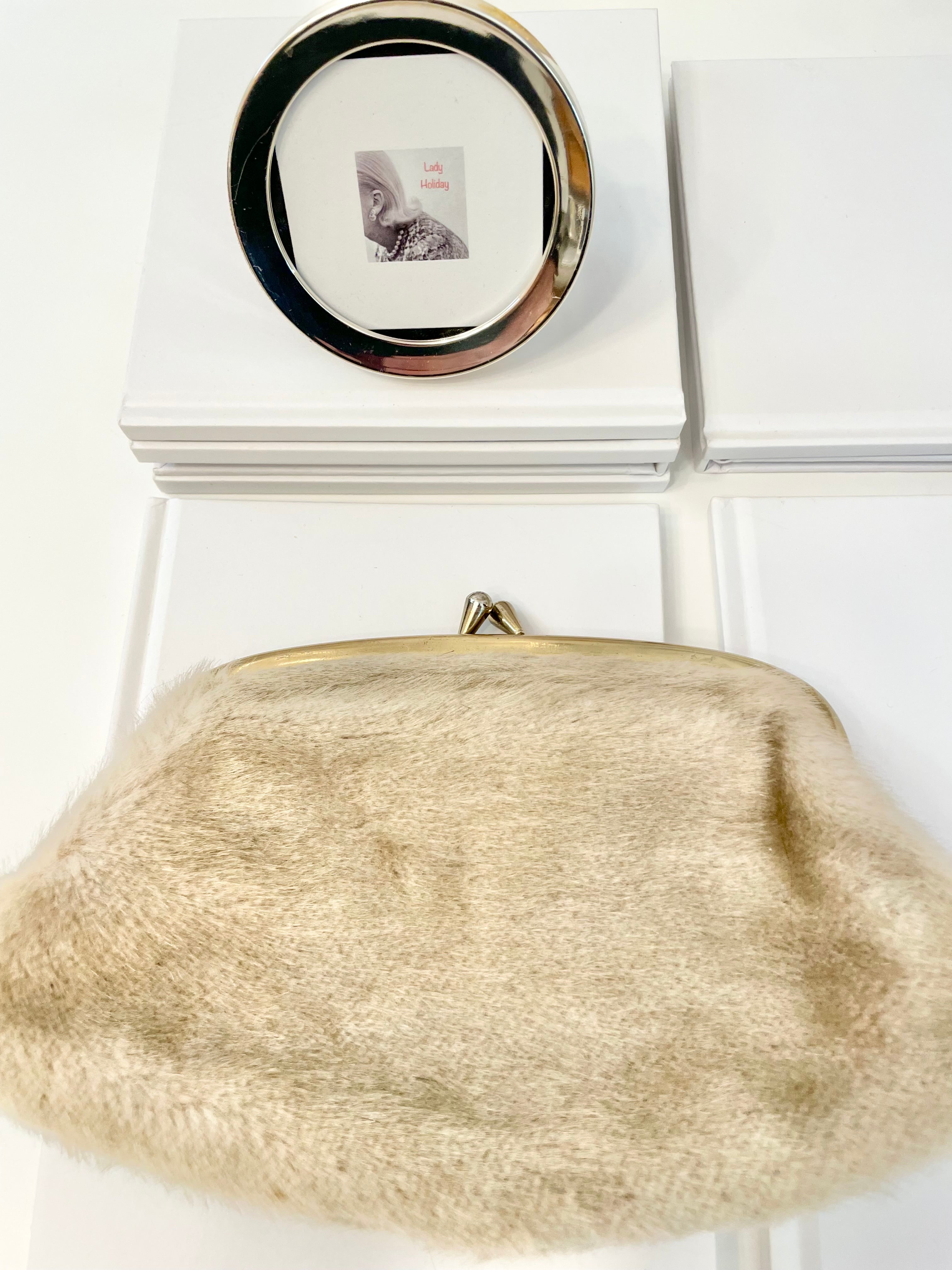 The 1960's Heiress loves a faux mink clutch bag!