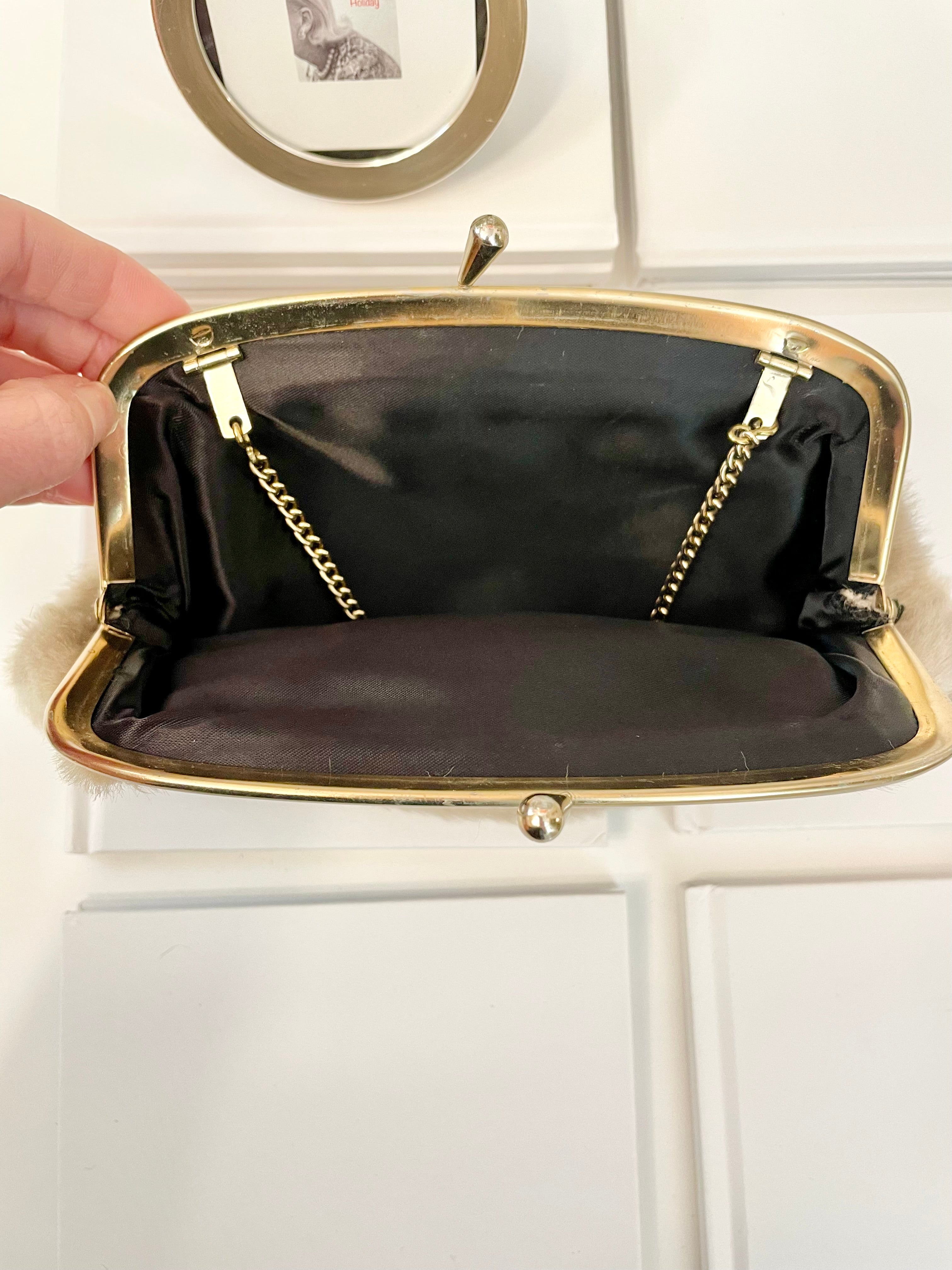 The 1960's Heiress loves a faux mink clutch bag!