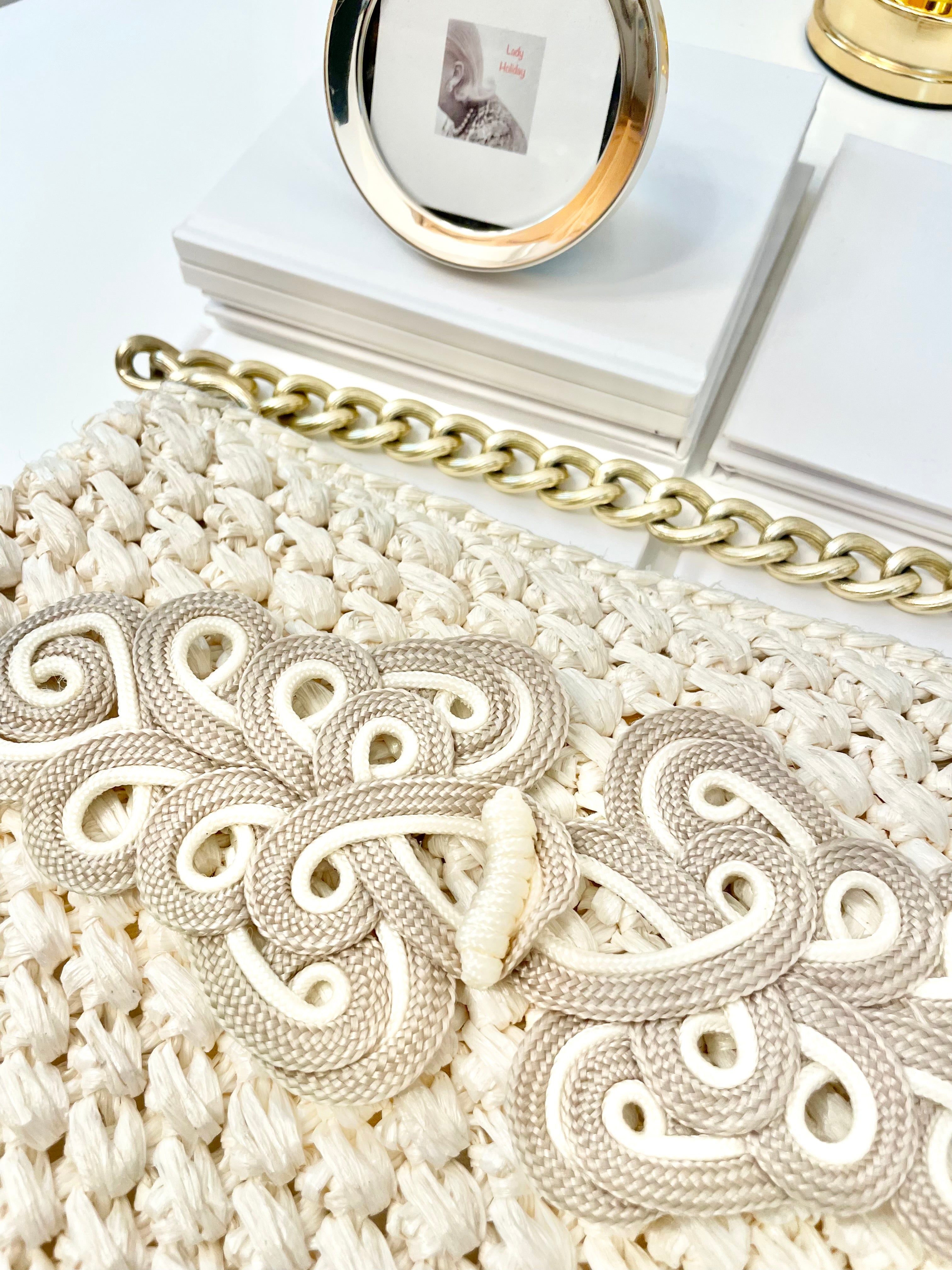 Vintage super sassy 1960's ivory straw bag with a classy gold chain... so elegant.