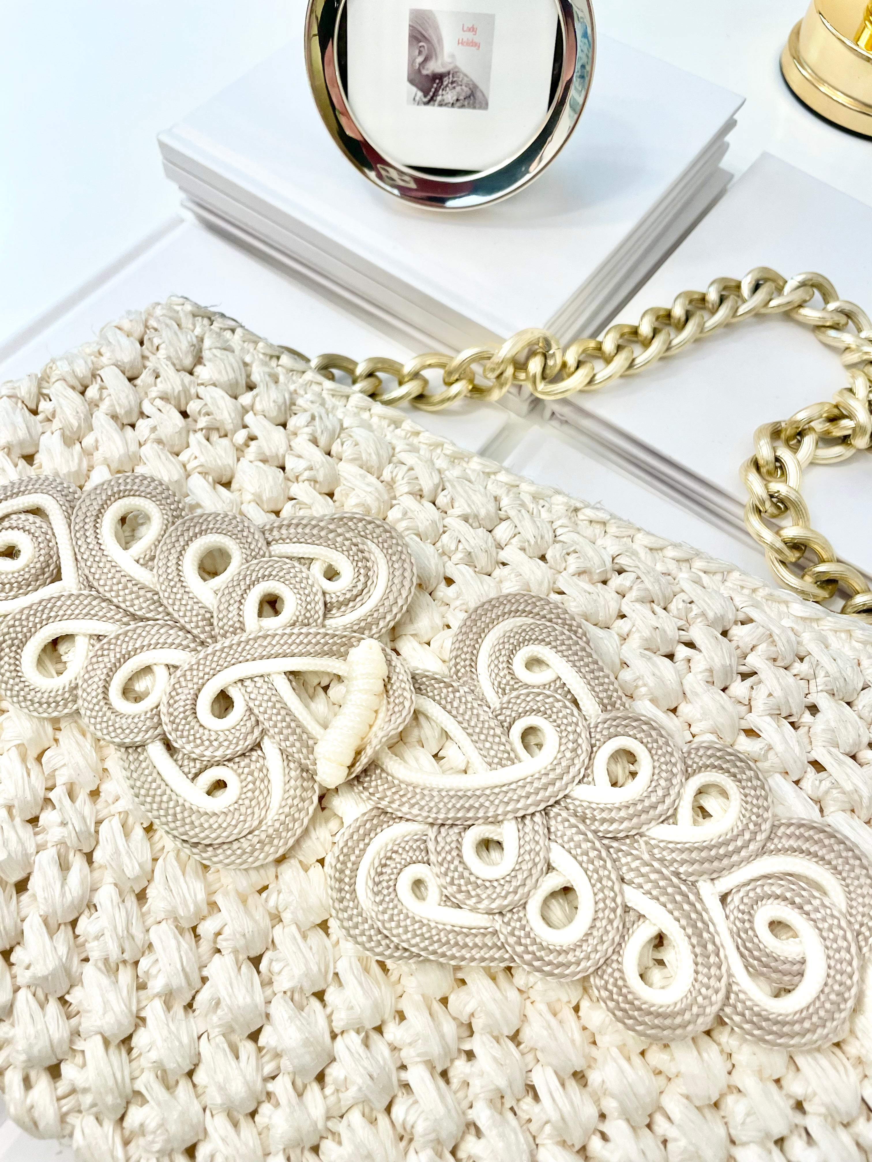 Vintage super sassy 1960's ivory straw bag with a classy gold chain... so elegant.