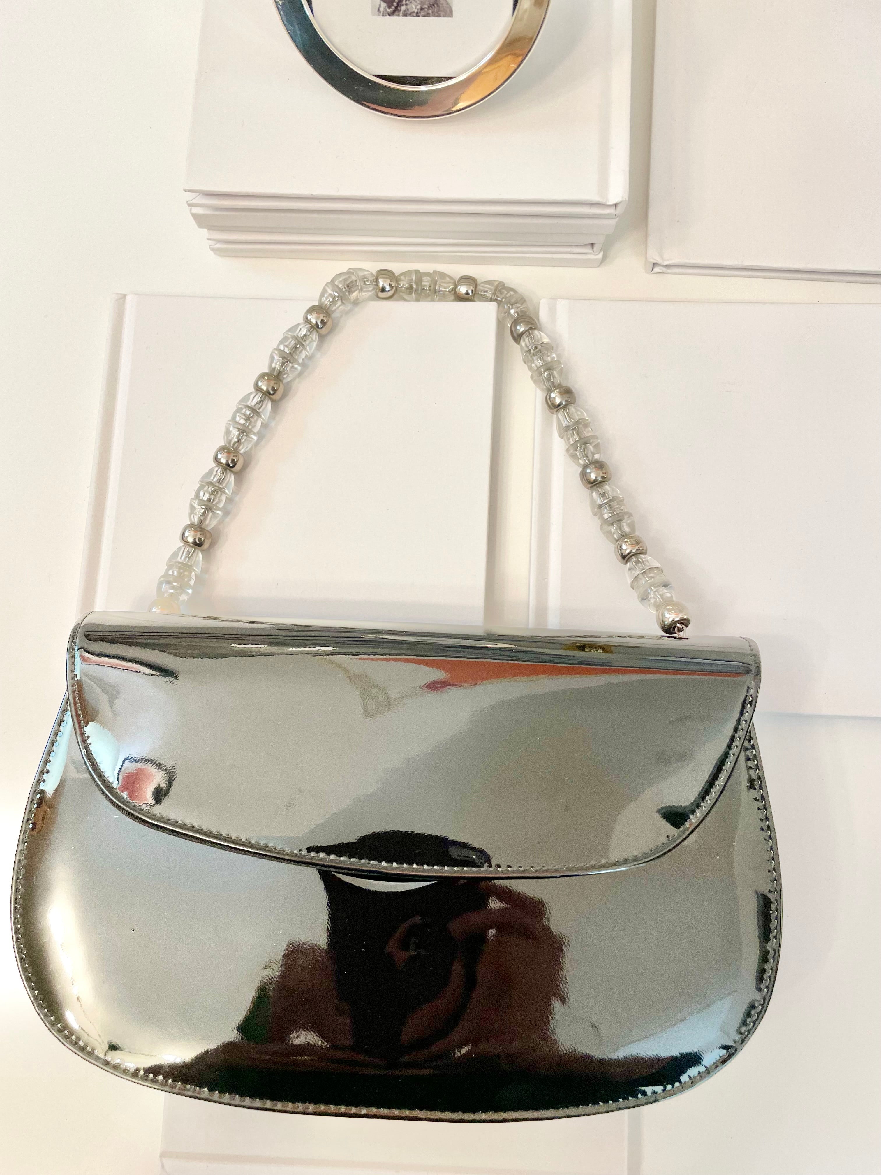 Truly classic faux patent leather, and lucite handle ladies purse... so classy!