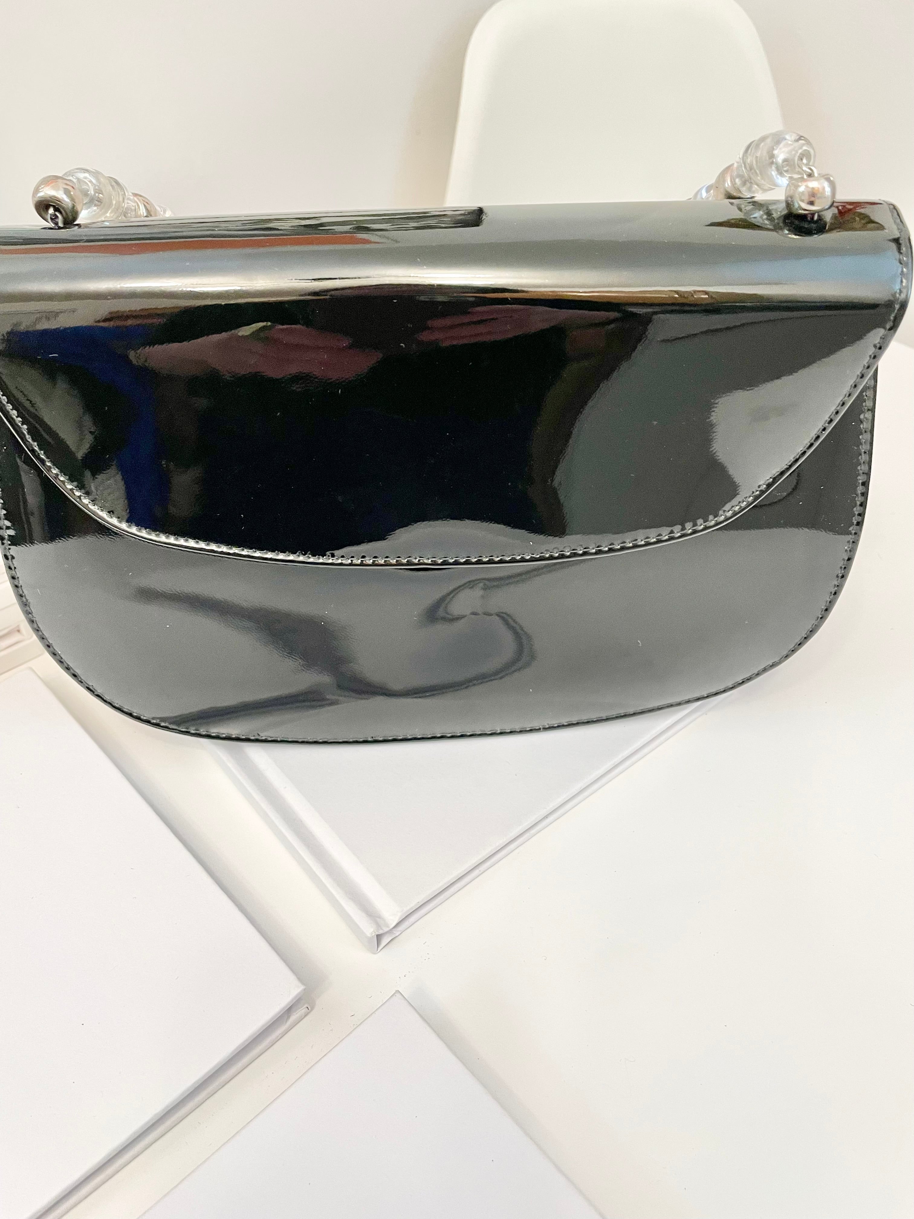 Truly classic faux patent leather, and lucite handle ladies purse... so classy!