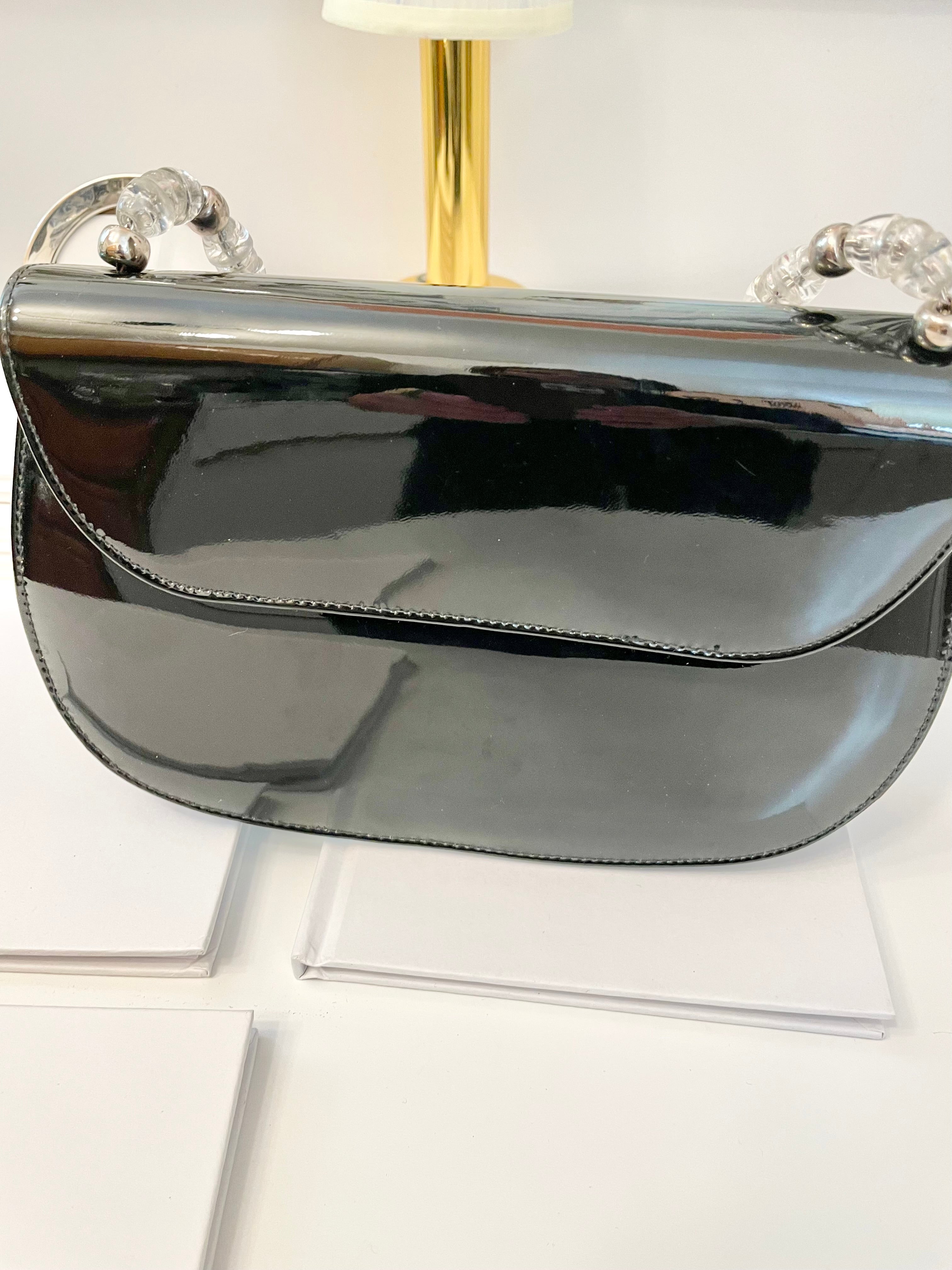 Truly classic faux patent leather, and lucite handle ladies purse... so classy!