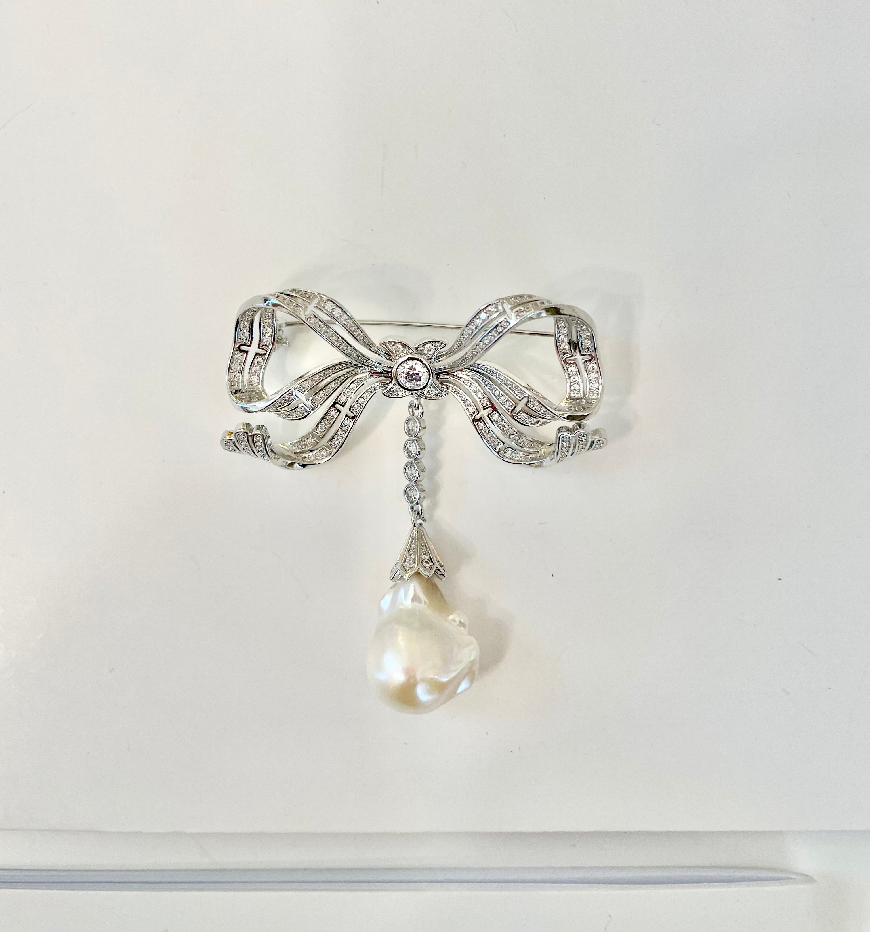 The most charming baroque fresh water pearl bow brooch.... so divine.