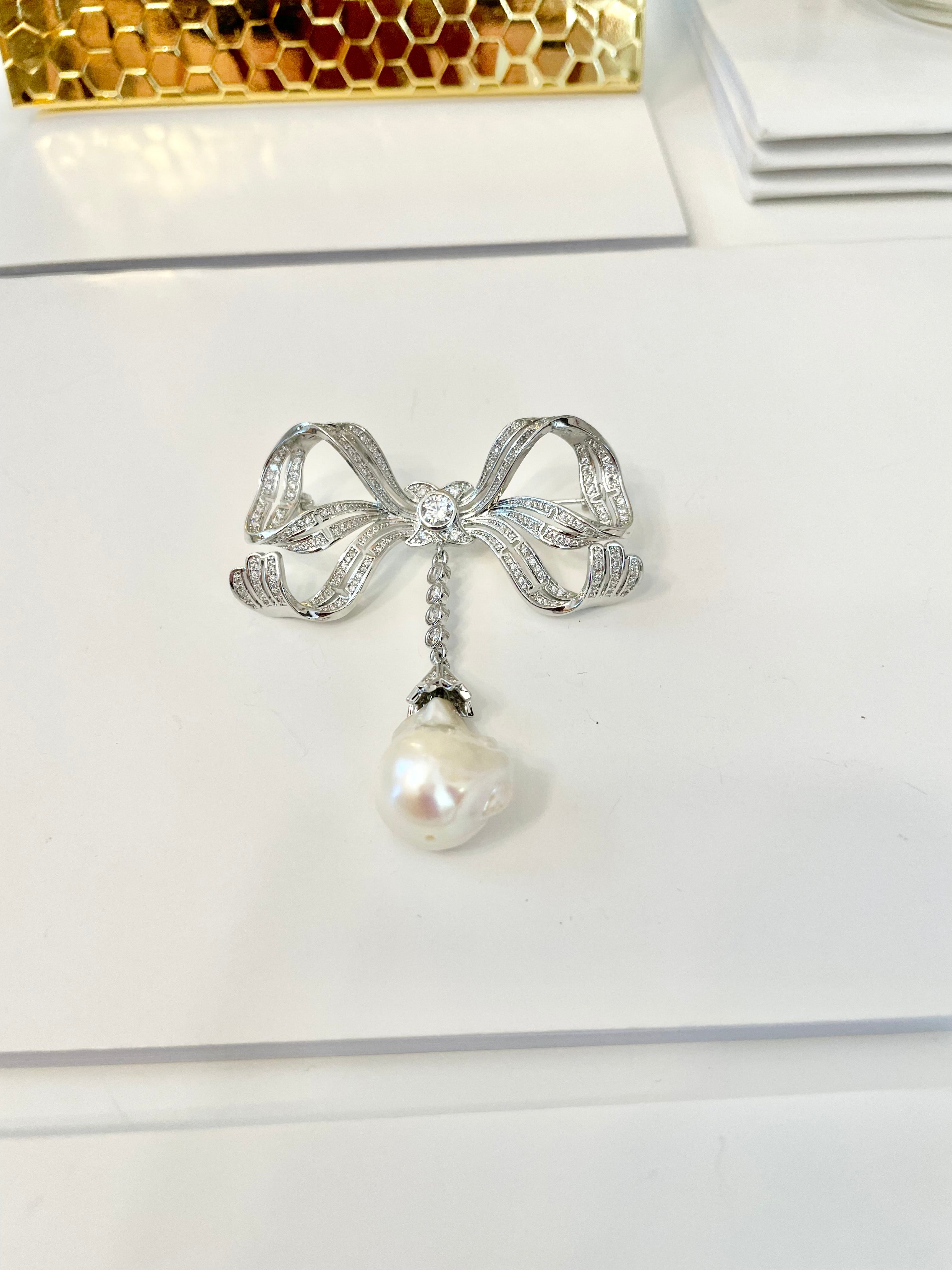 The most charming baroque fresh water pearl bow brooch.... so divine.