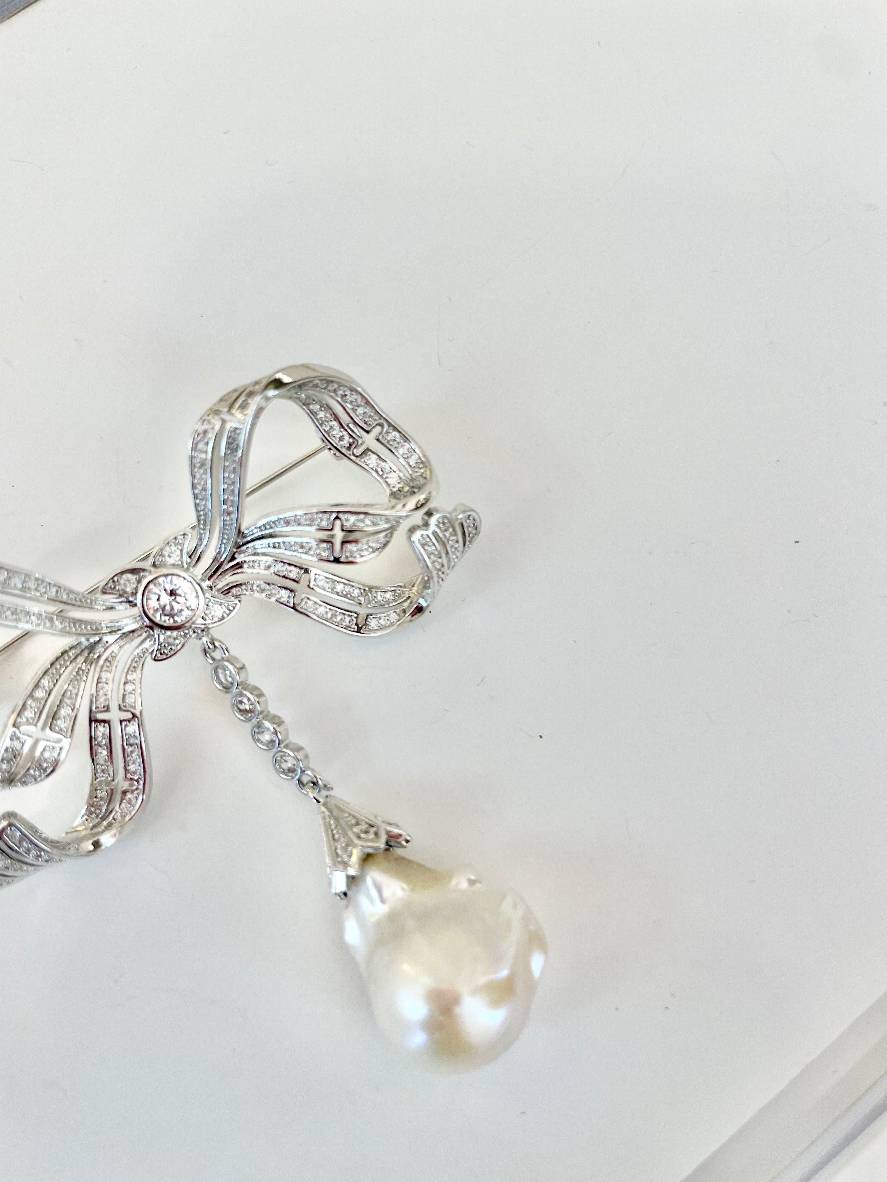 The most charming baroque fresh water pearl bow brooch.... so divine.