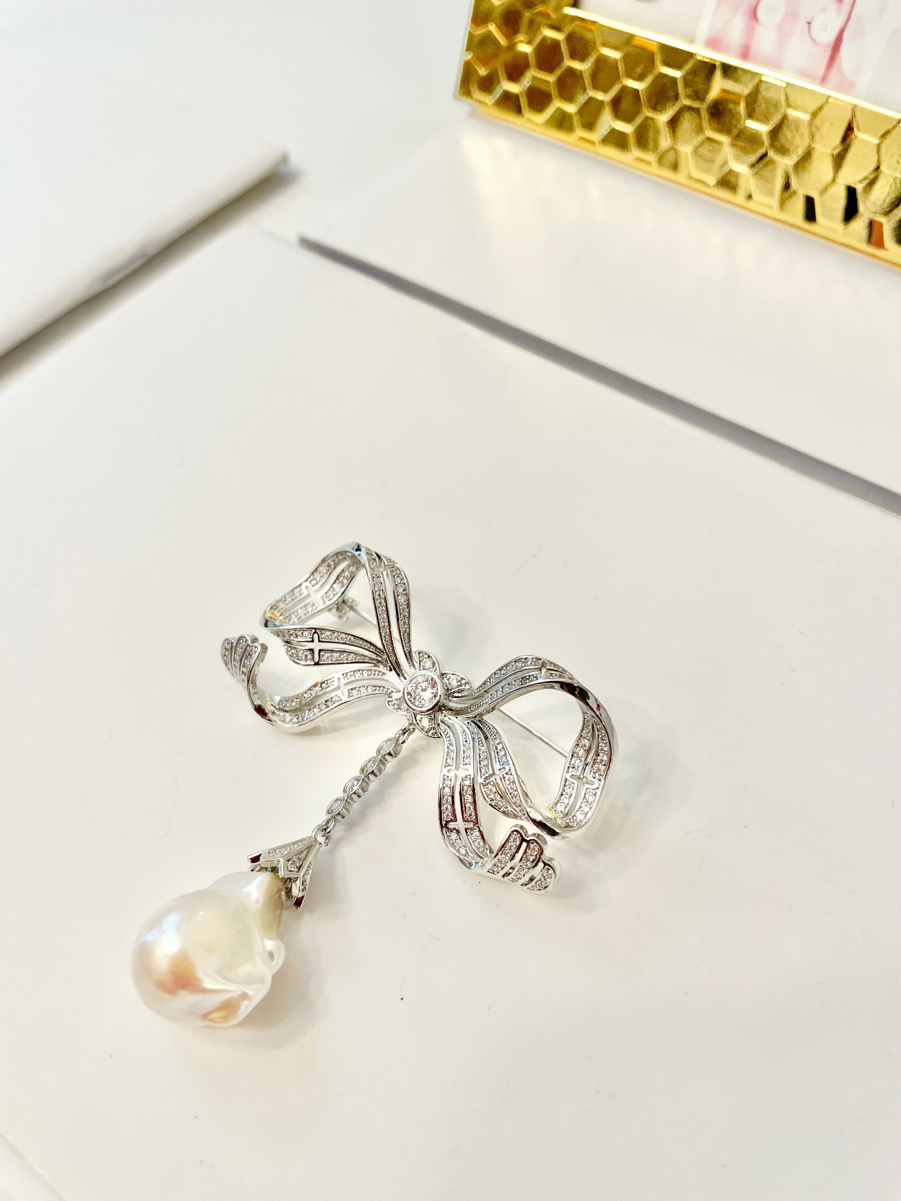 The most charming baroque fresh water pearl bow brooch.... so divine.