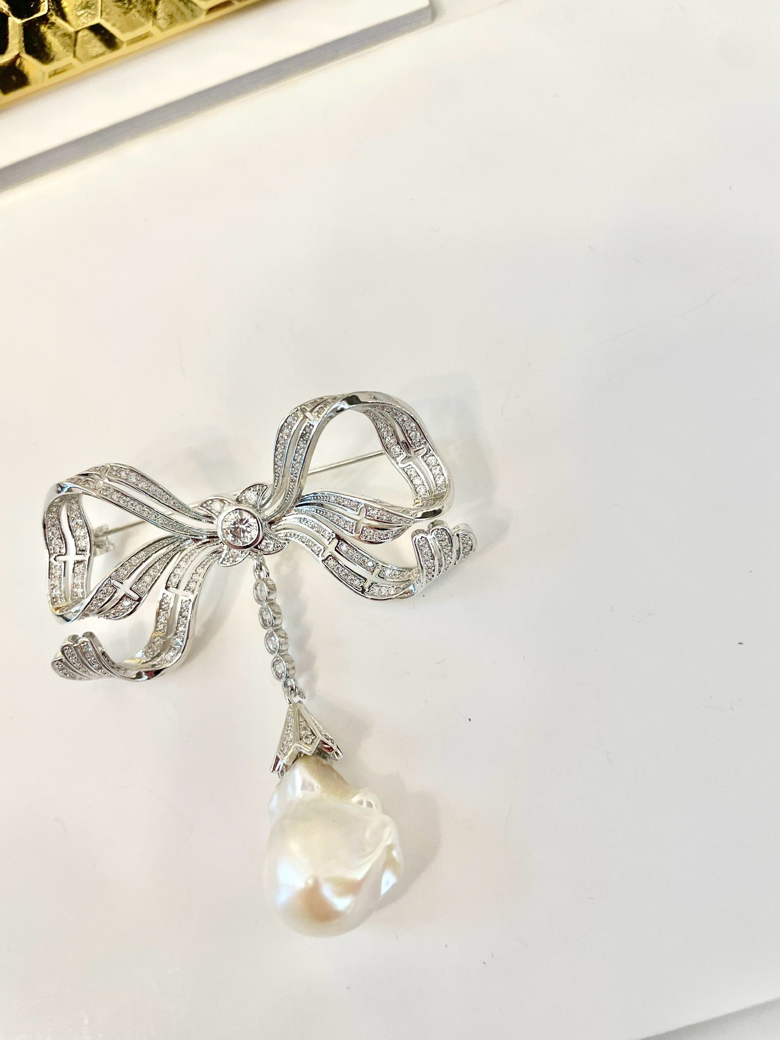 The most charming baroque fresh water pearl bow brooch.... so divine.