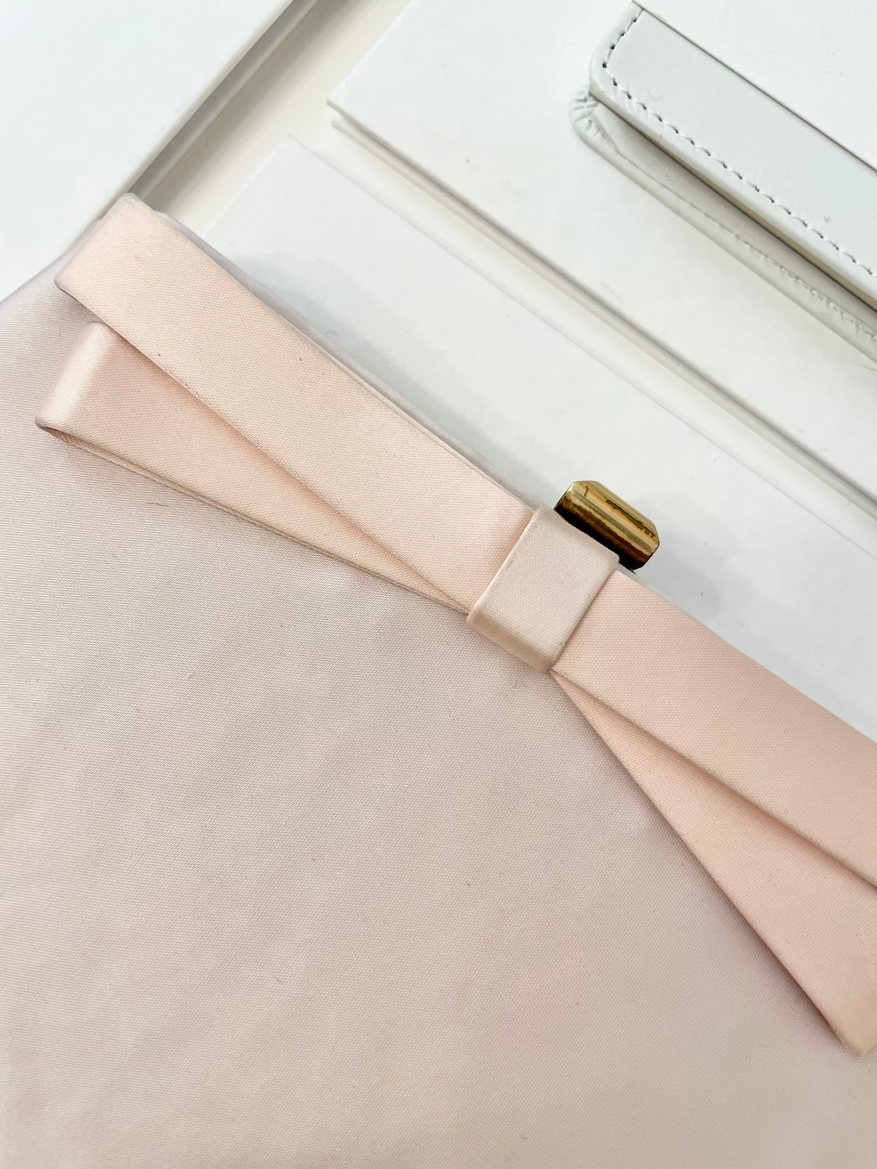 Vintage flirty gal and her love of soft pink.. this satin bow clutch is so pretty!