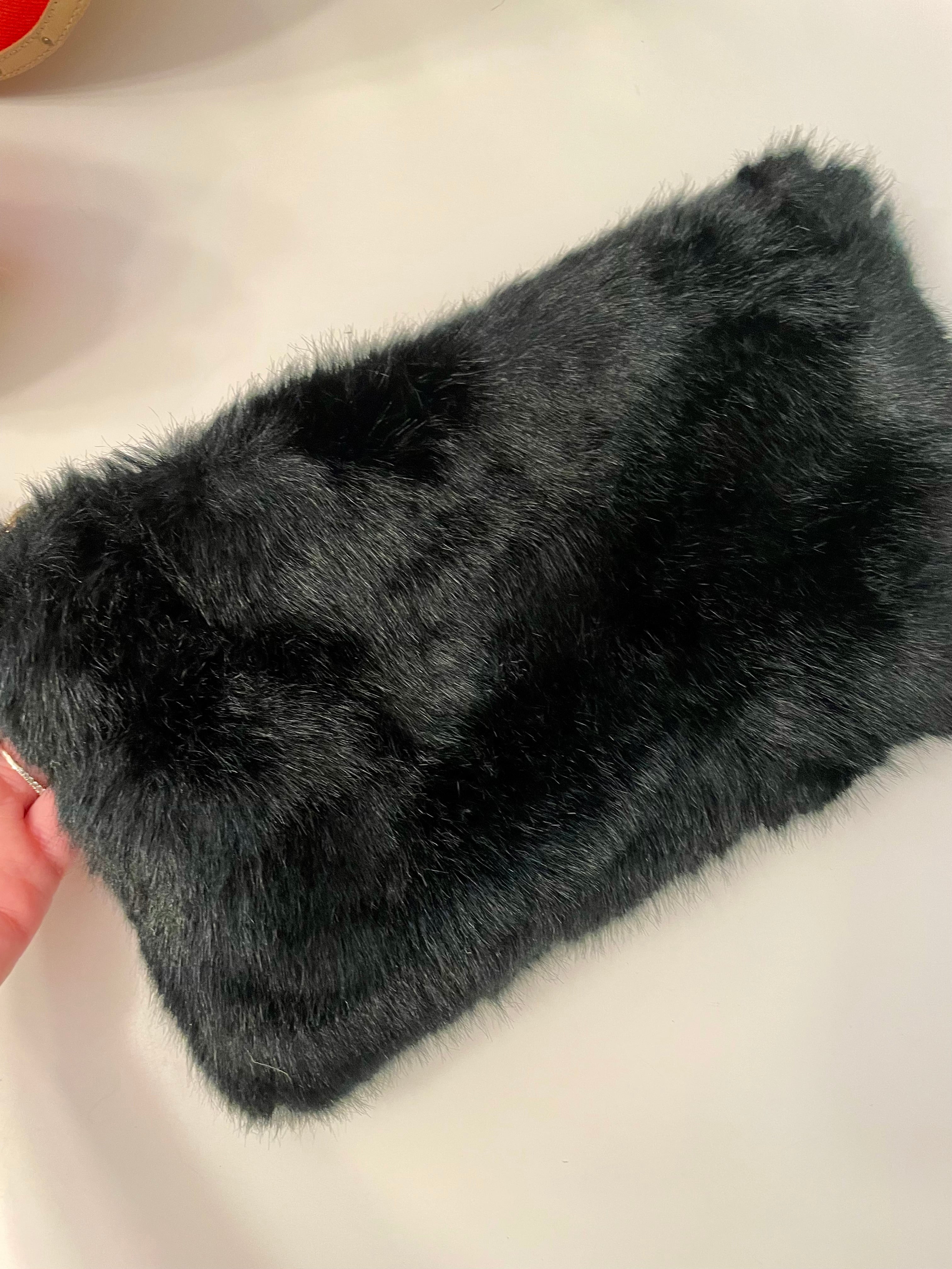 Ladies on Holiday and her love of a classy evening bag This noir faux fur clutch bag is so charming